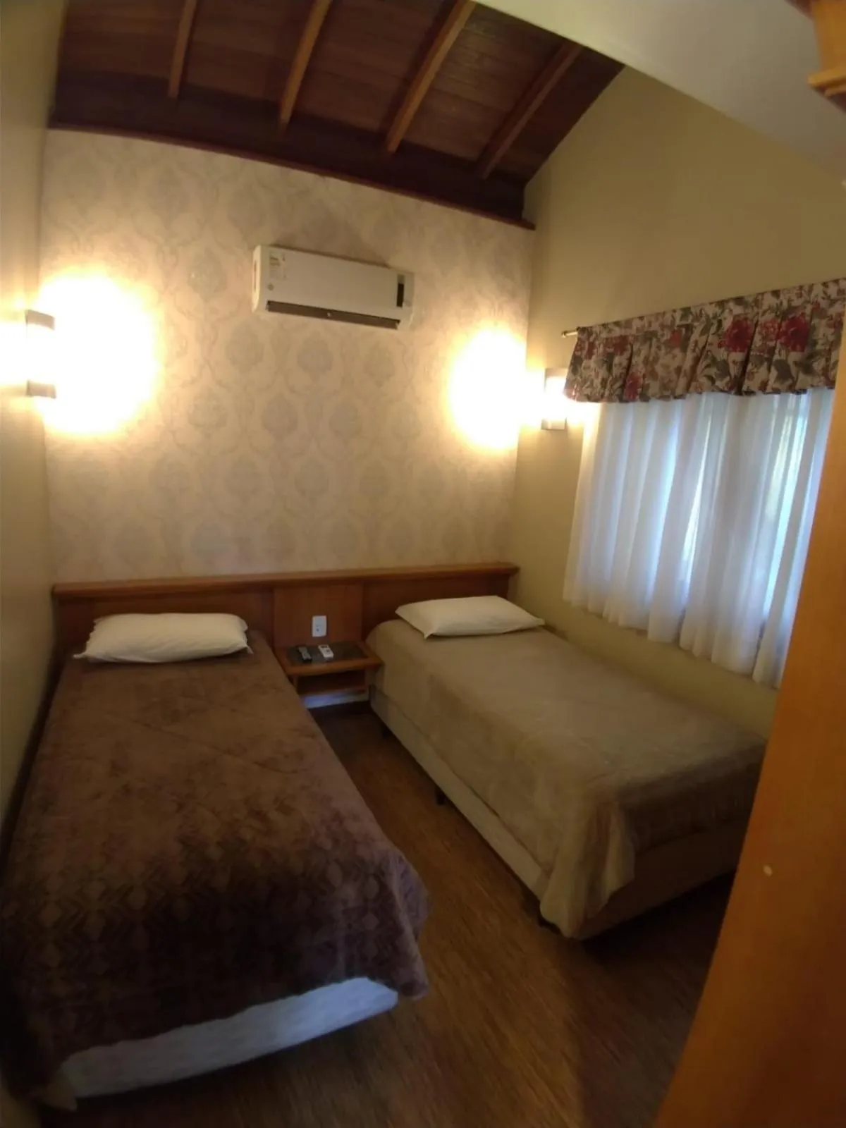 Bed in Pousada Das Papoulas