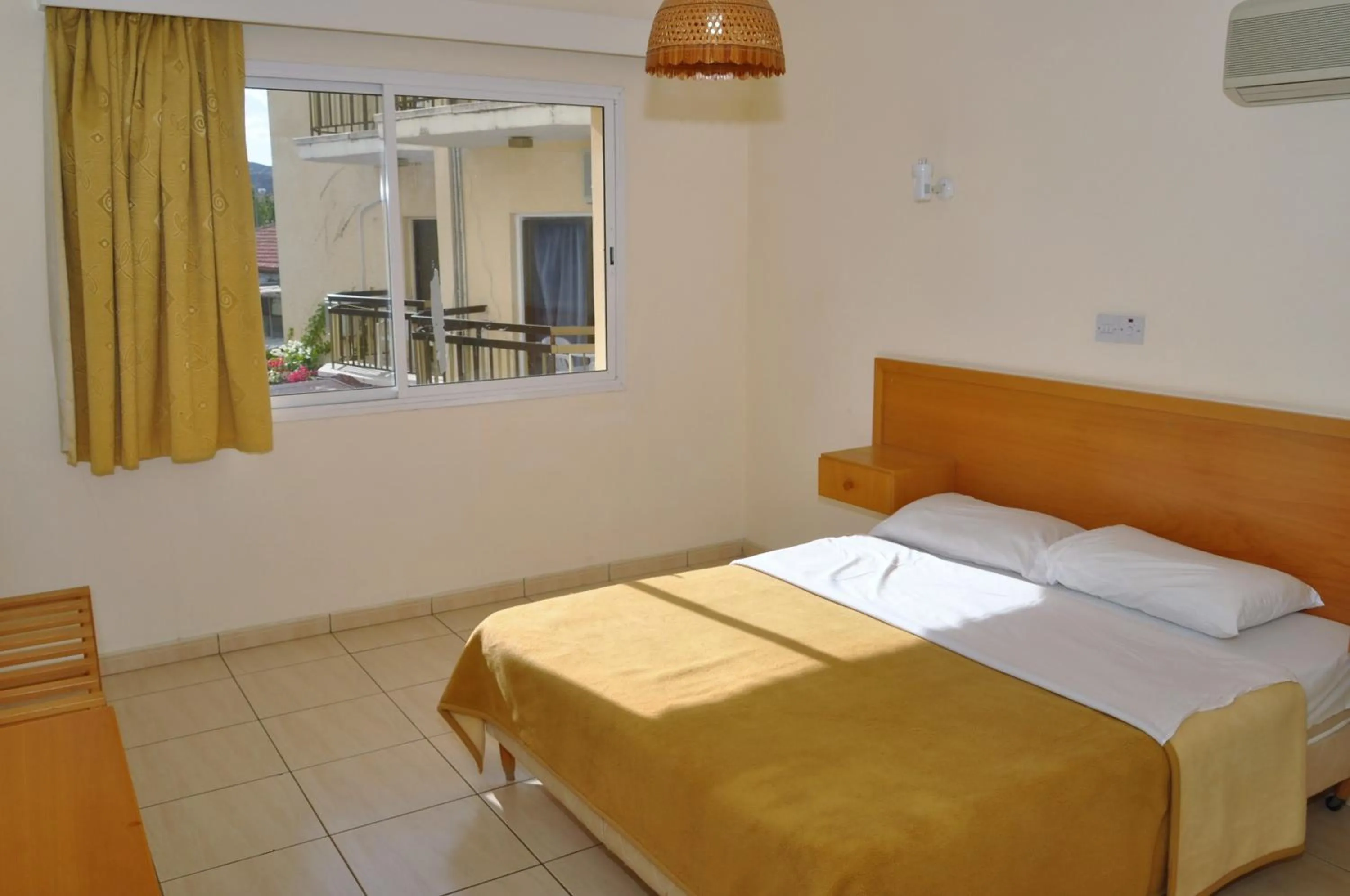 Bed in Mariela Hotel Apartments