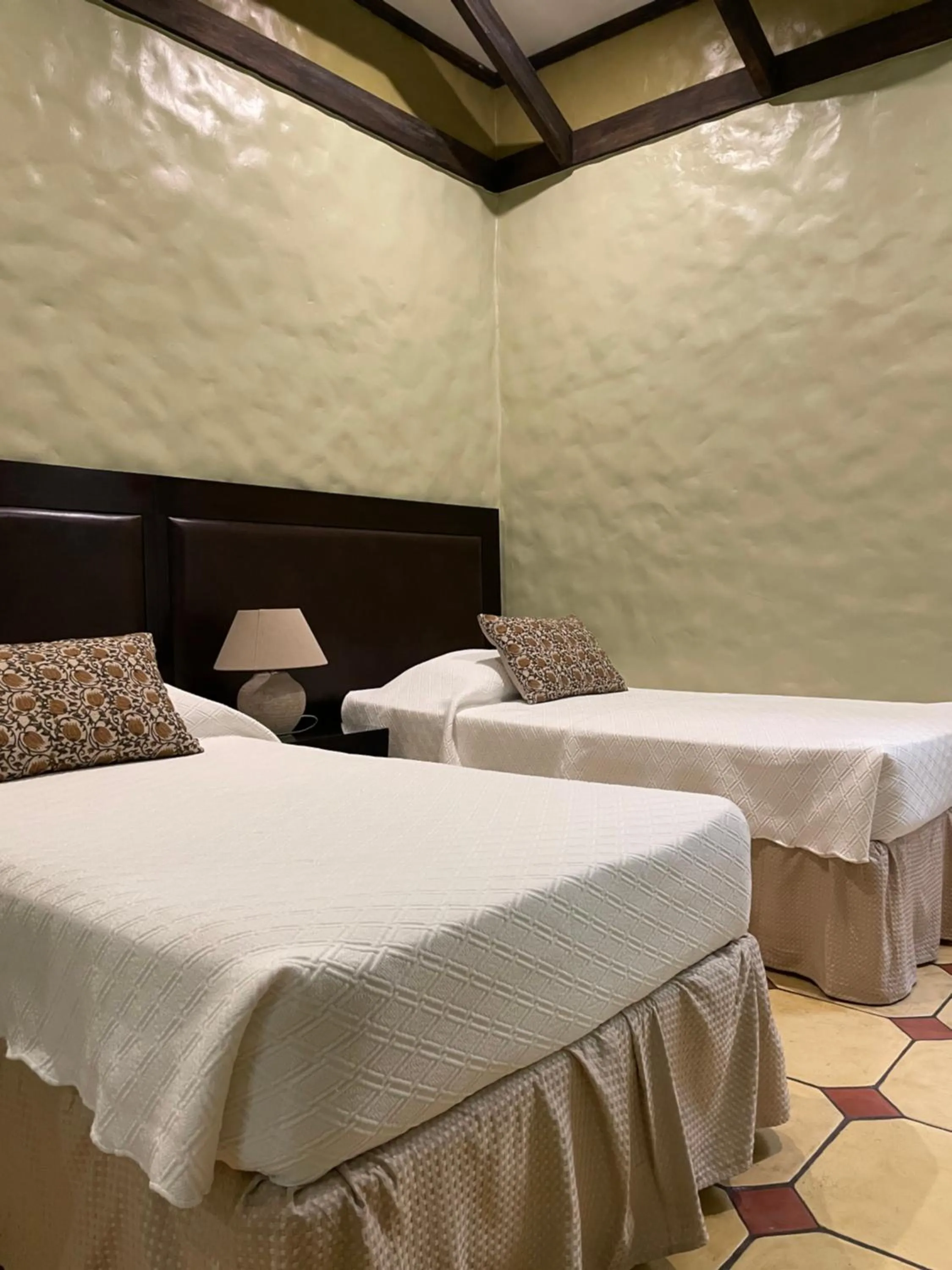 Bed in Hotel 1915 INN & SUITES