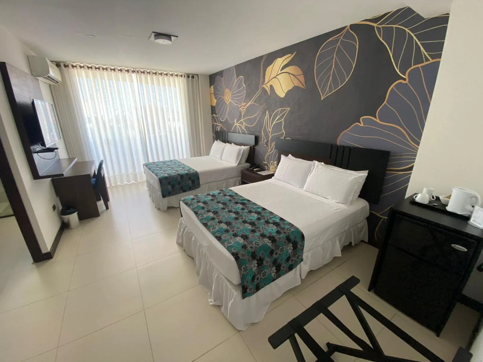 Bed in Mai Suites Apart Hotel