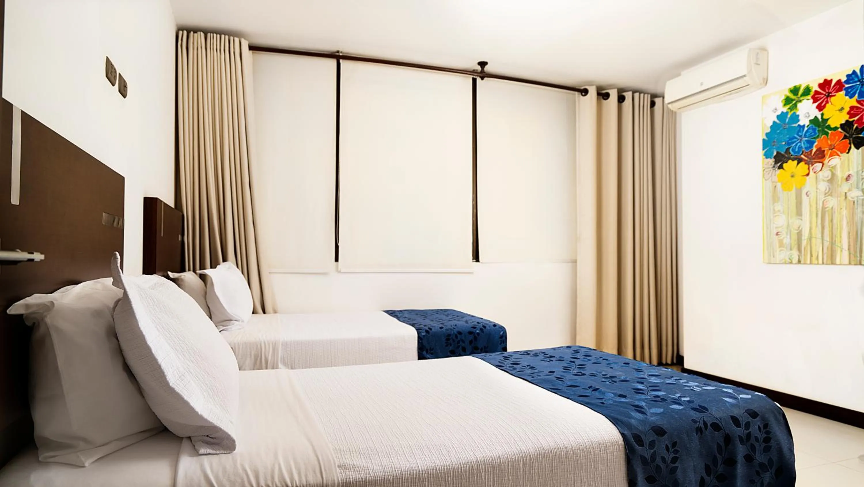 Bed in Mai Suites Apart Hotel