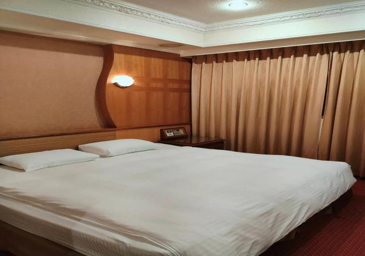Bed in Champion Hotel
