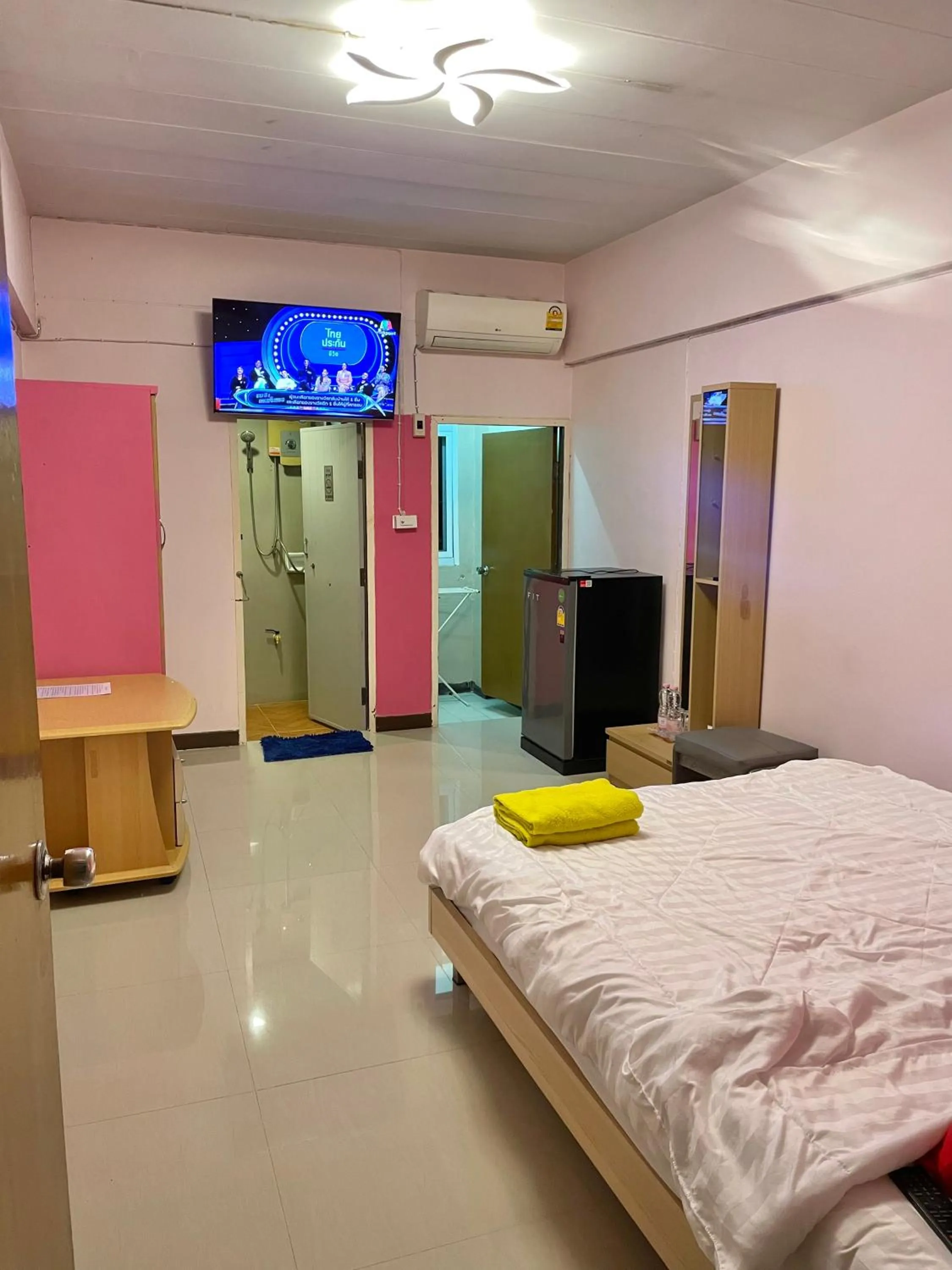 Bed in Gedkanok Apartment