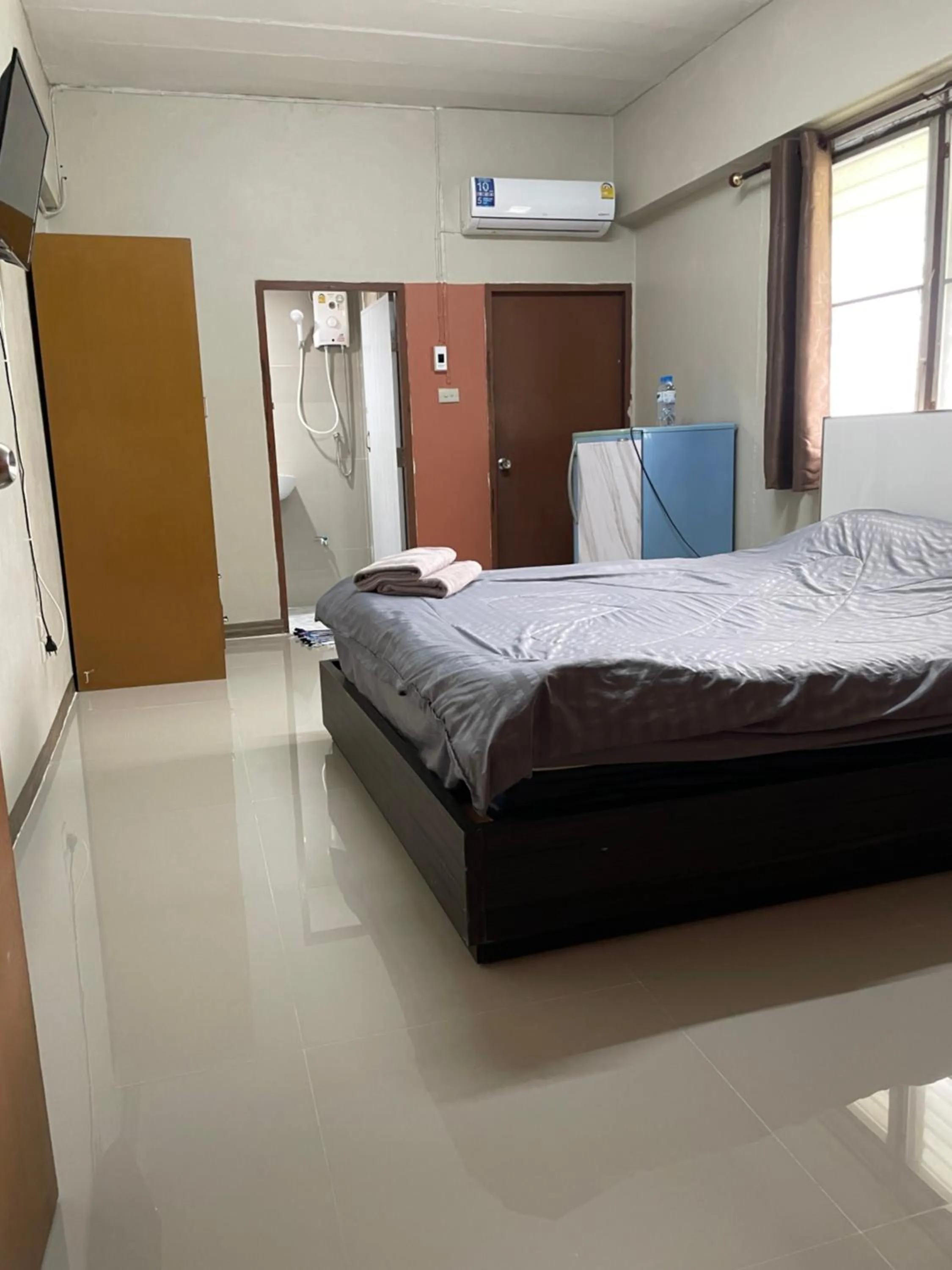 Bed in Gedkanok Apartment