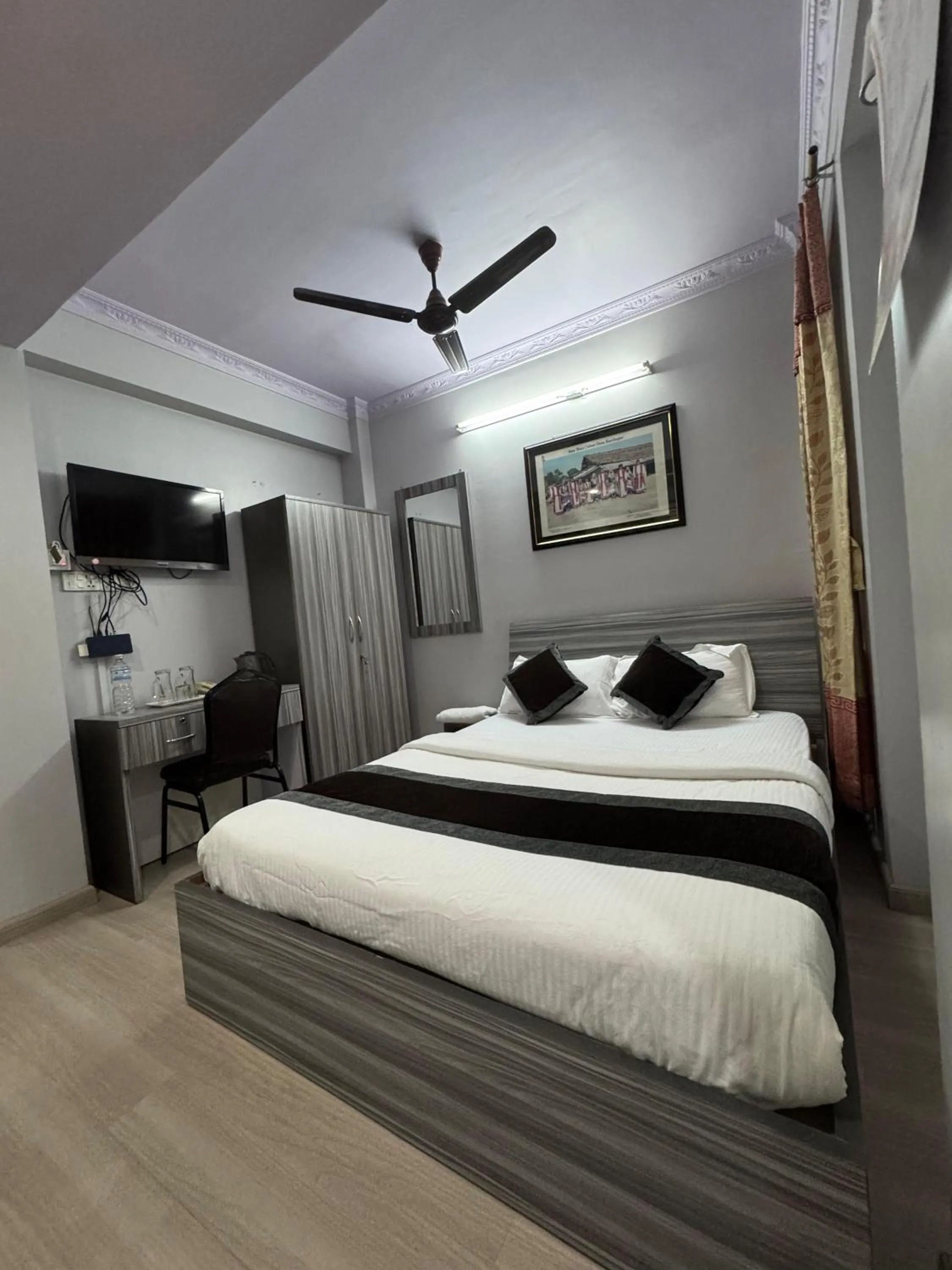 Bed in Three Brothers Apartment and Hotel