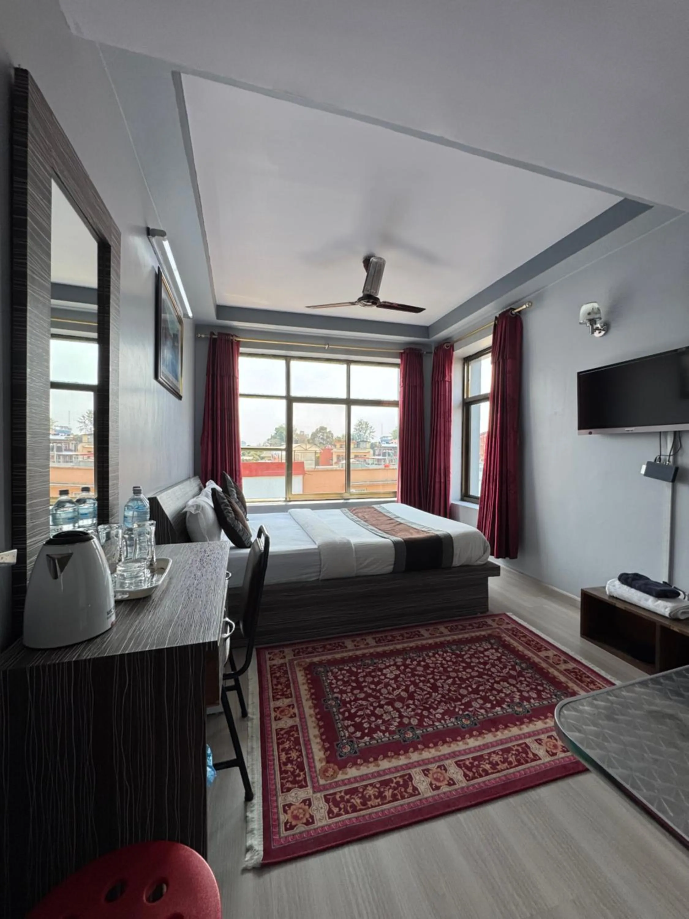 Bed in Three Brothers Apartment and Hotel