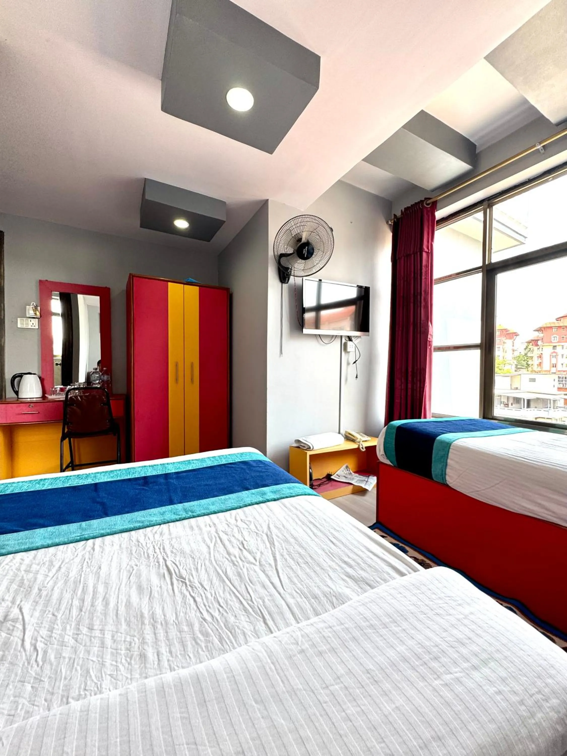Bed in Three Brothers Apartment and Hotel