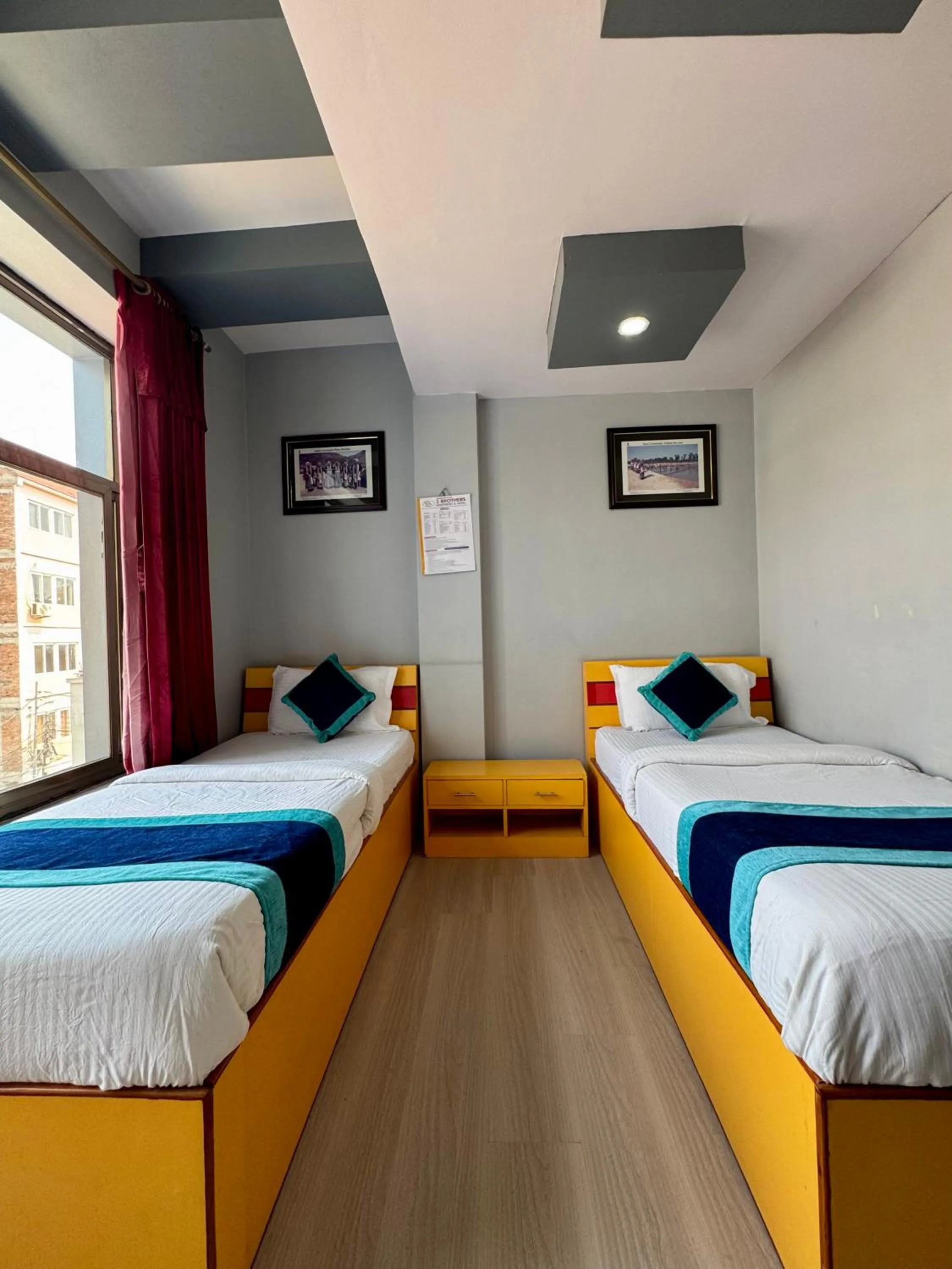 Bed in Three Brothers Apartment and Hotel