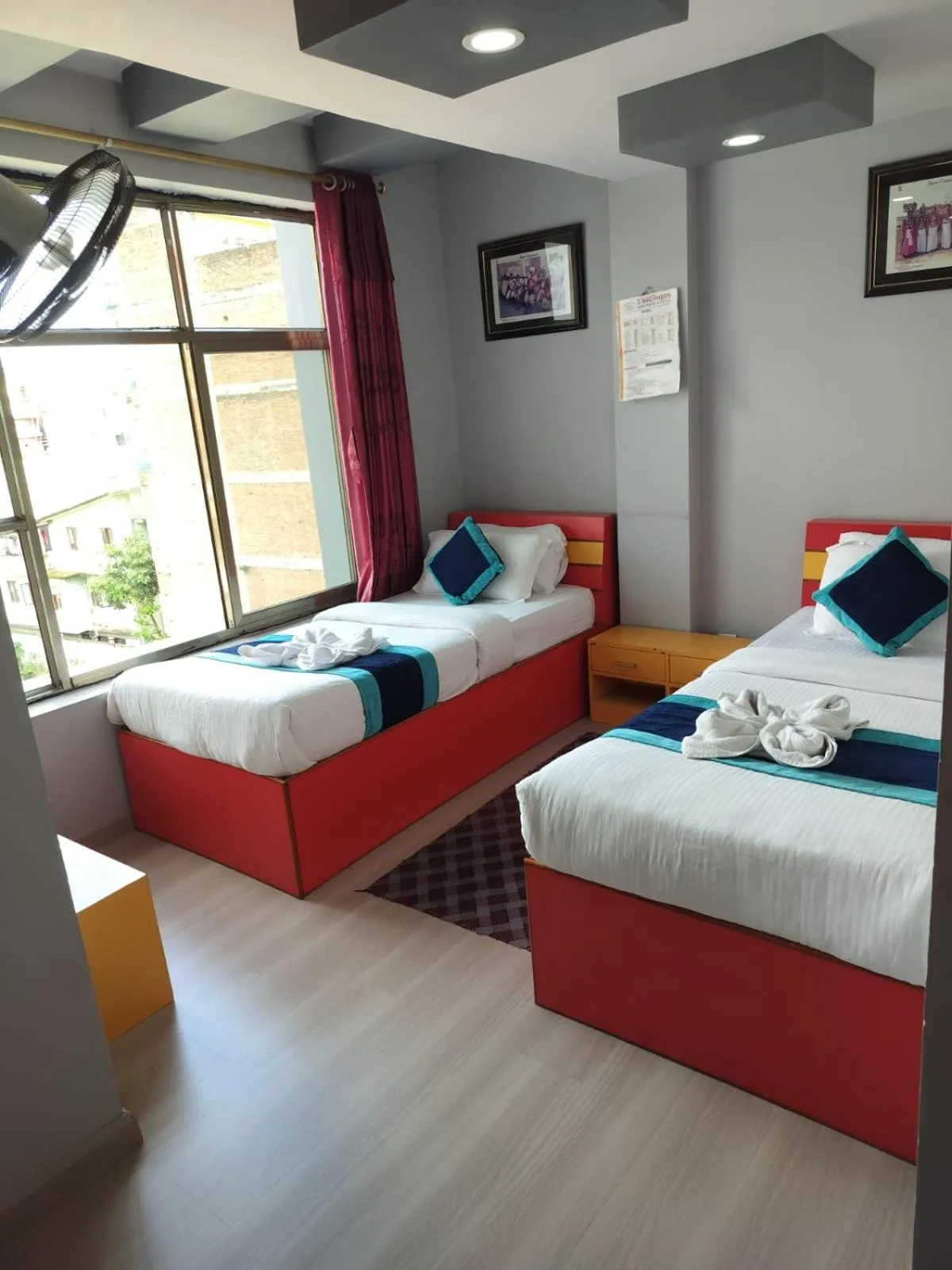 Bed in Three Brothers Apartment and Hotel