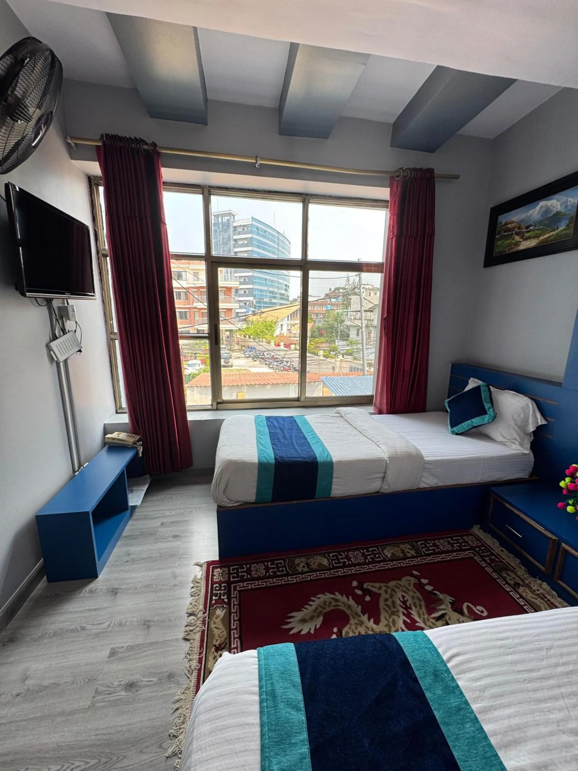 Bed in Three Brothers Apartment and Hotel