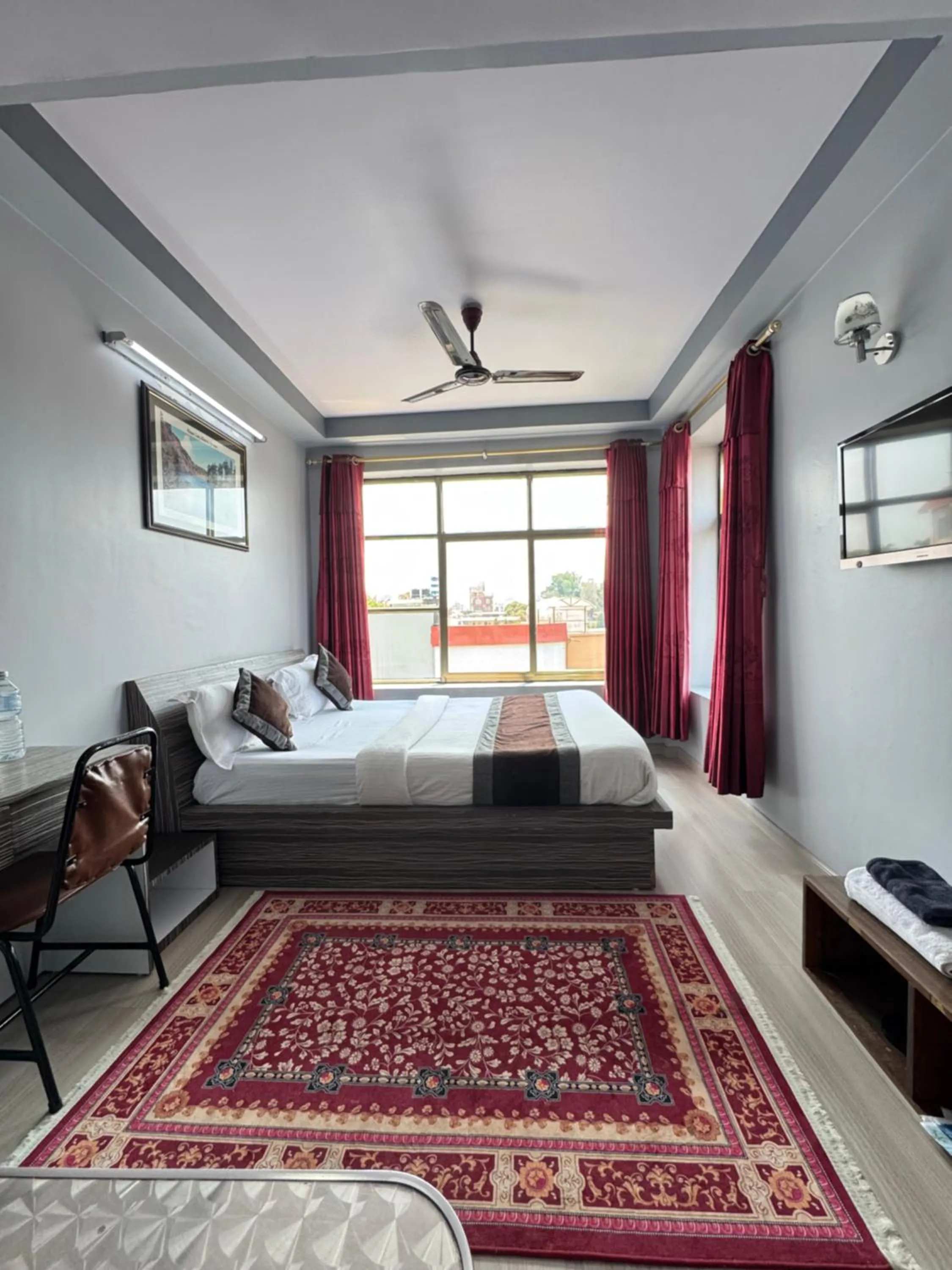 Bed in Three Brothers Apartment and Hotel