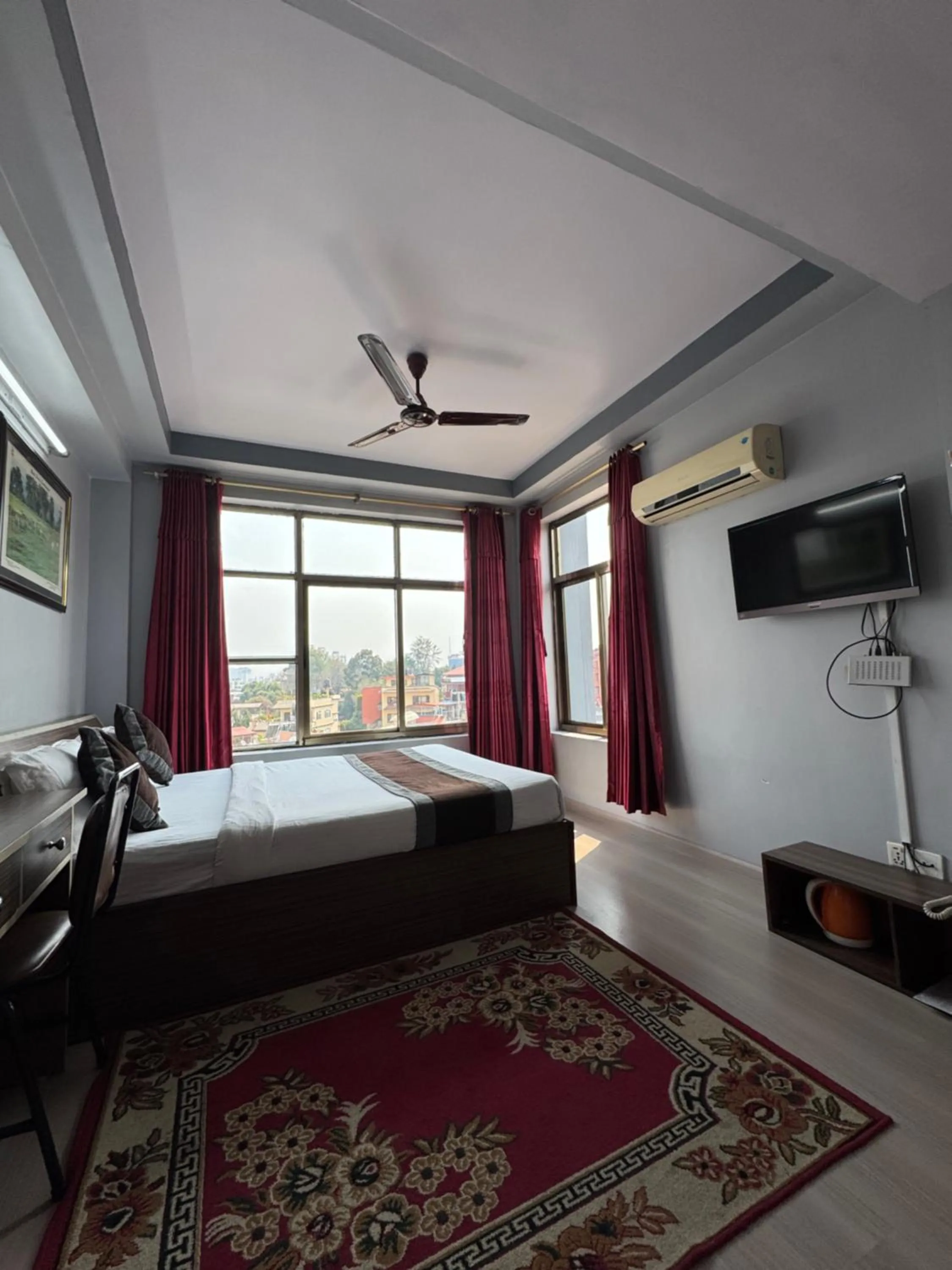 Bed in Three Brothers Apartment and Hotel