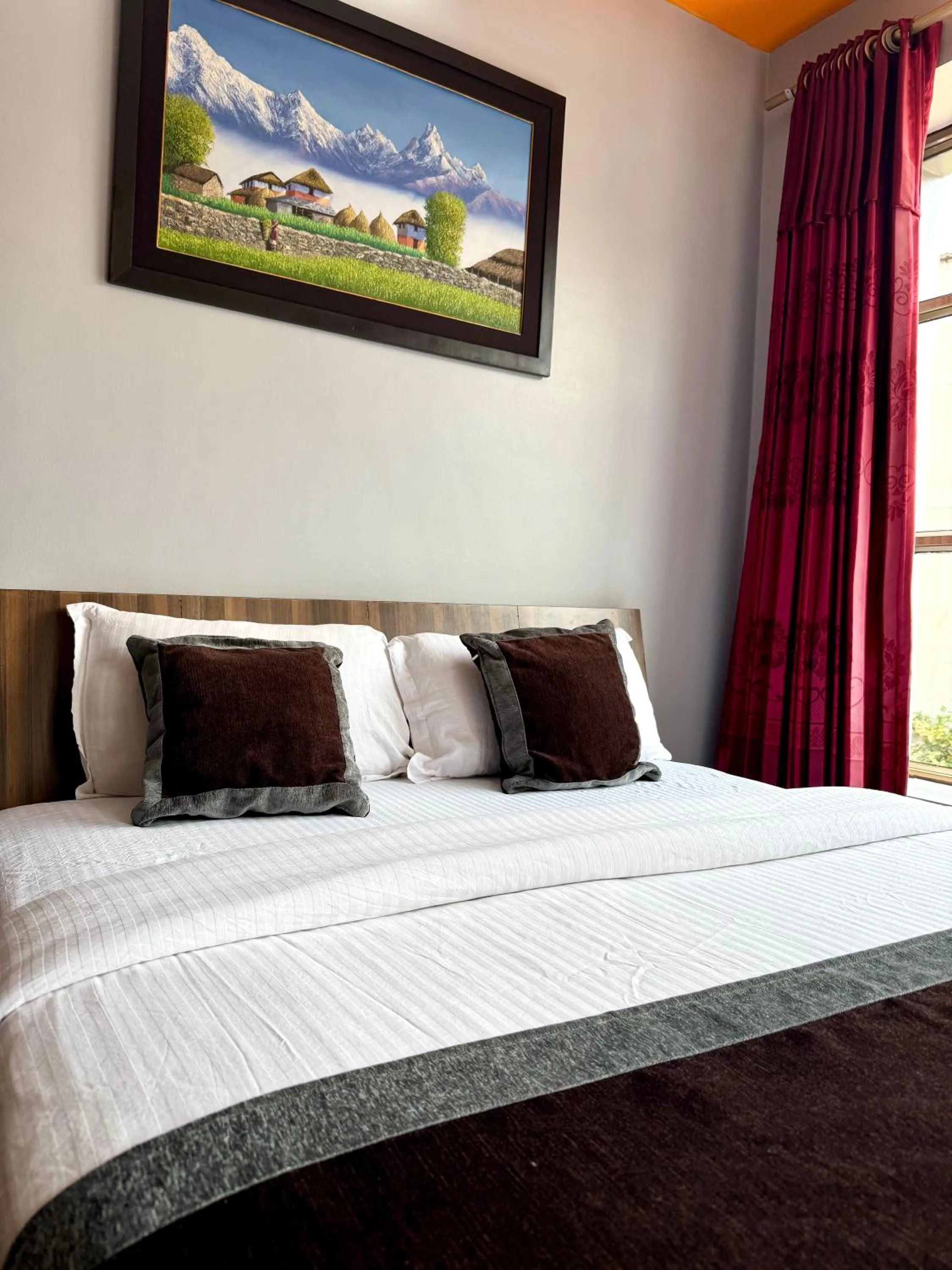 Bed in Three Brothers Apartment and Hotel