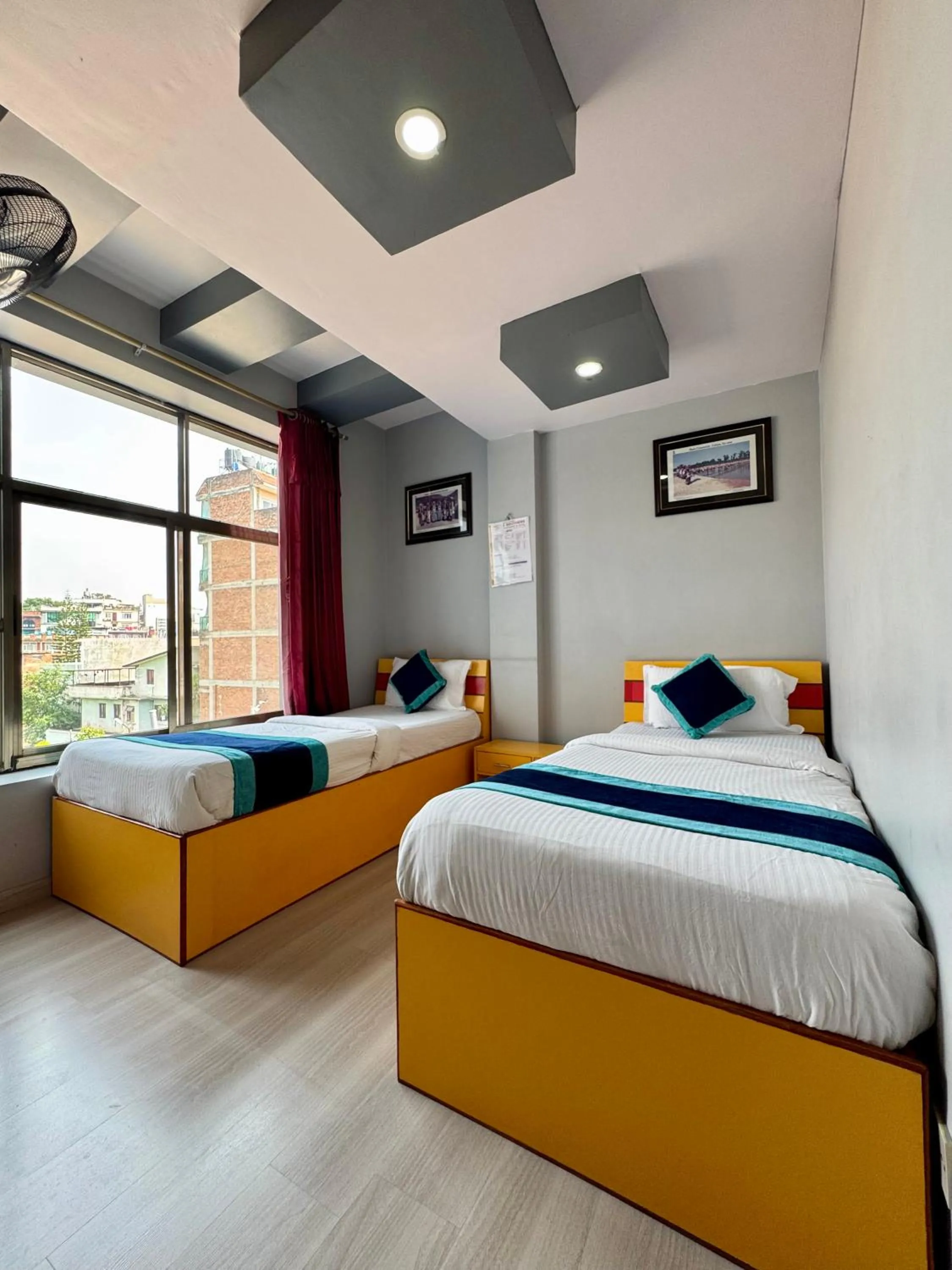 Bed in Three Brothers Apartment and Hotel