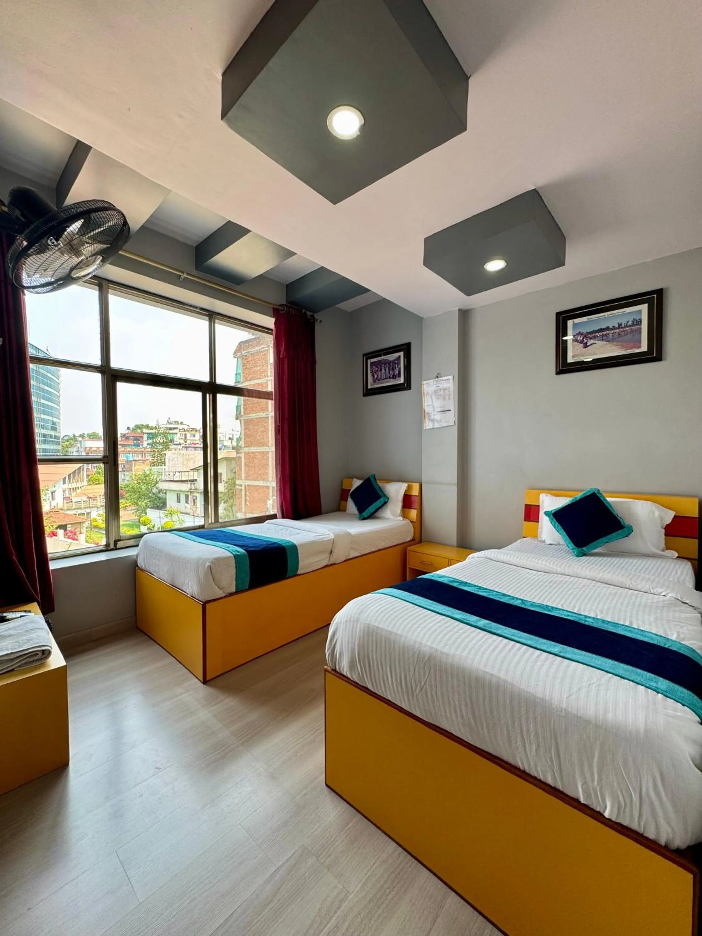 Bed in Three Brothers Apartment and Hotel