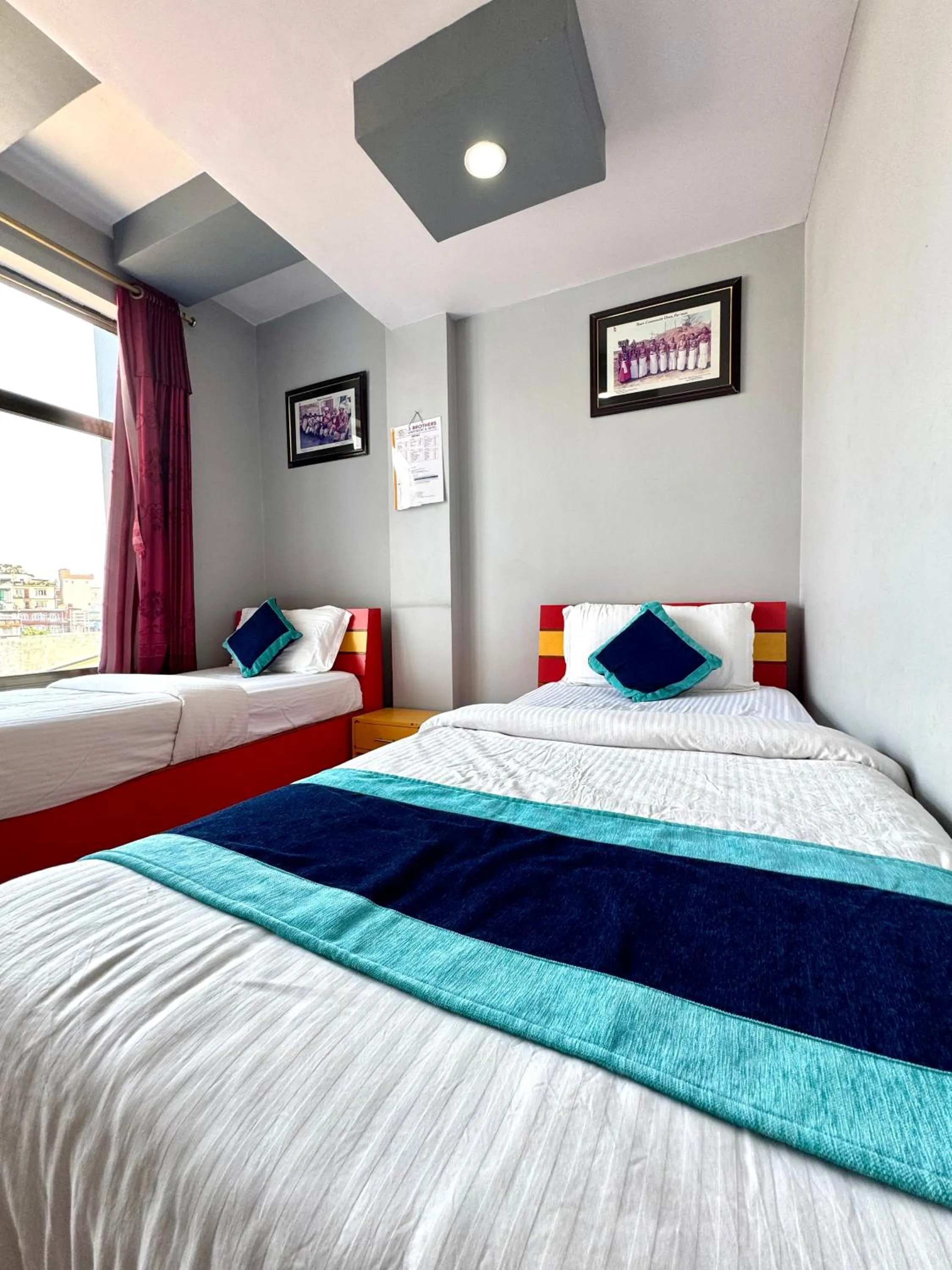 Bed in Three Brothers Apartment and Hotel