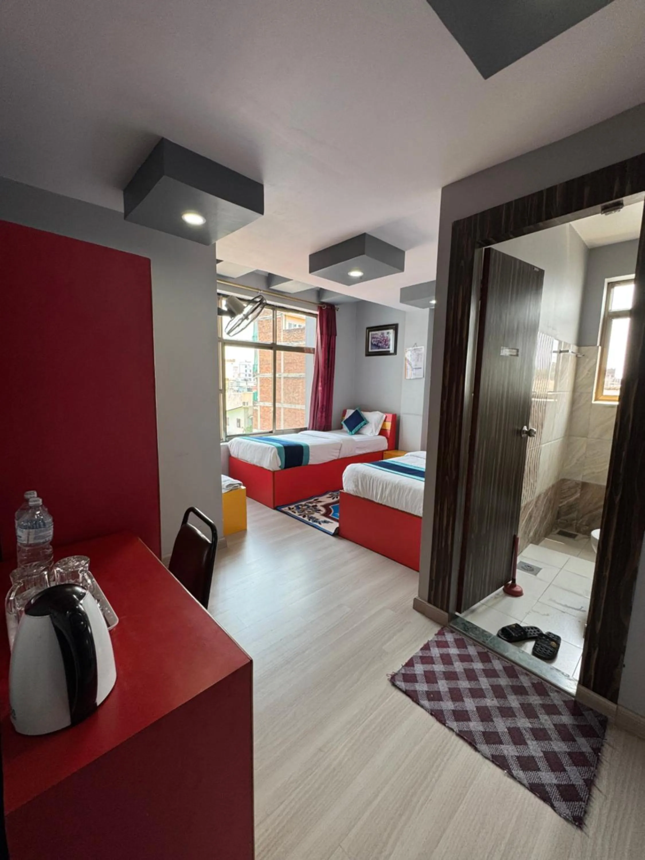 Bed in Three Brothers Apartment and Hotel