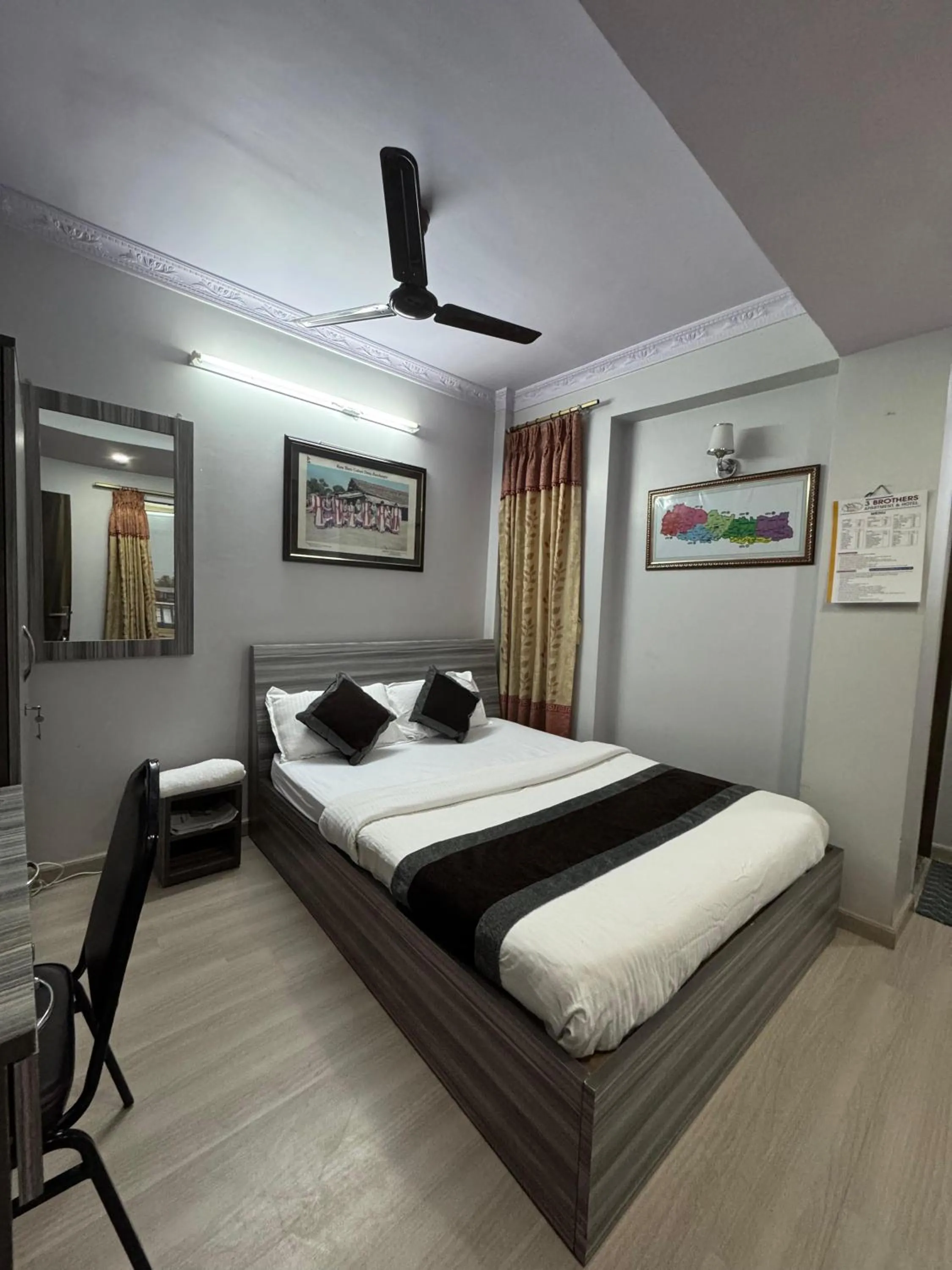 Bed in Three Brothers Apartment and Hotel