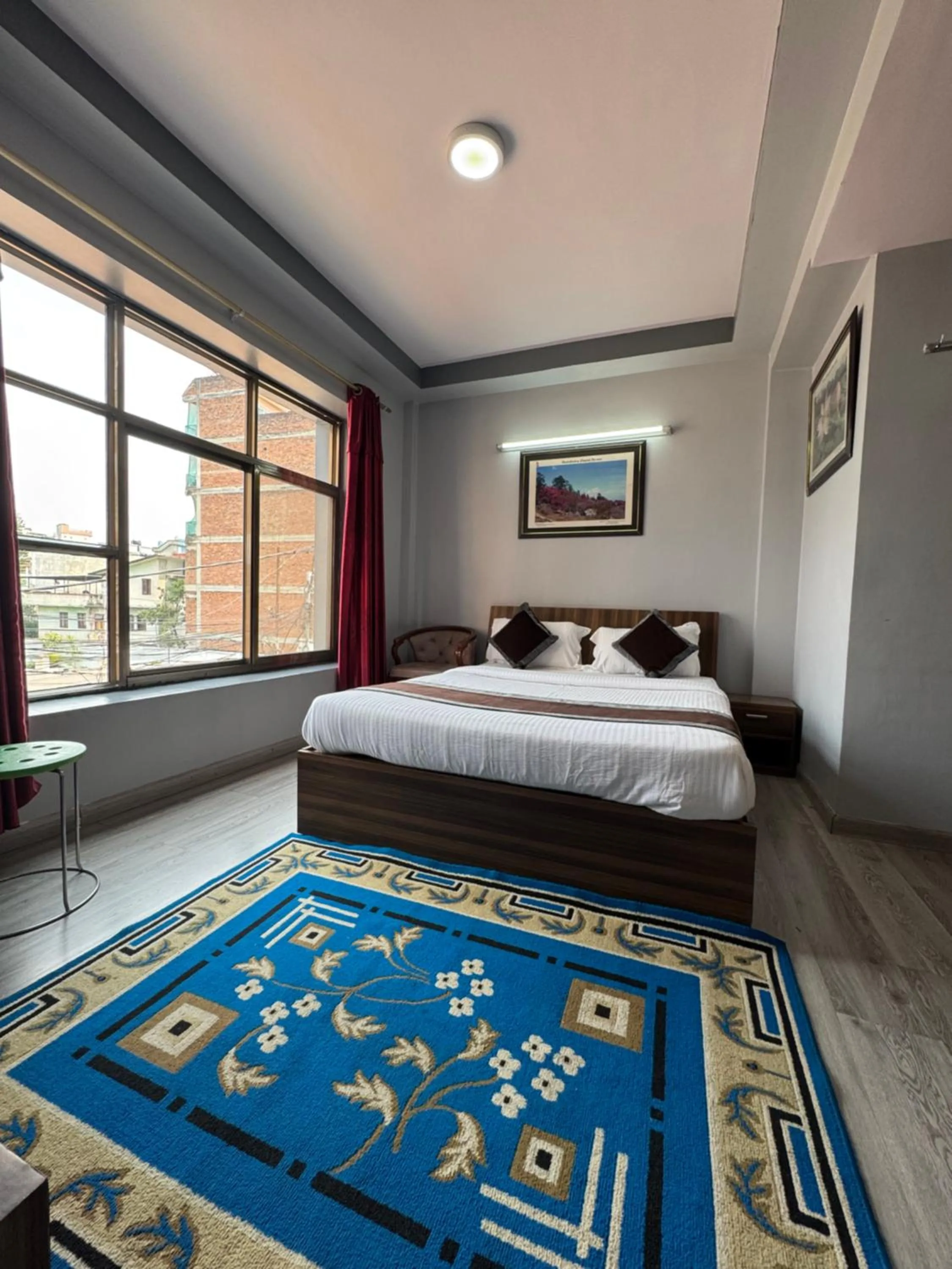 Bed in Three Brothers Apartment and Hotel