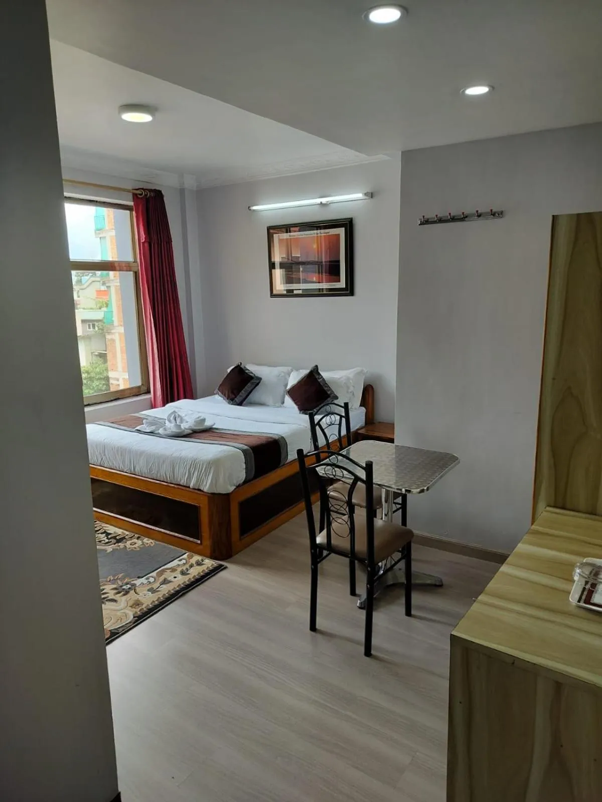 Bed in Three Brothers Apartment and Hotel