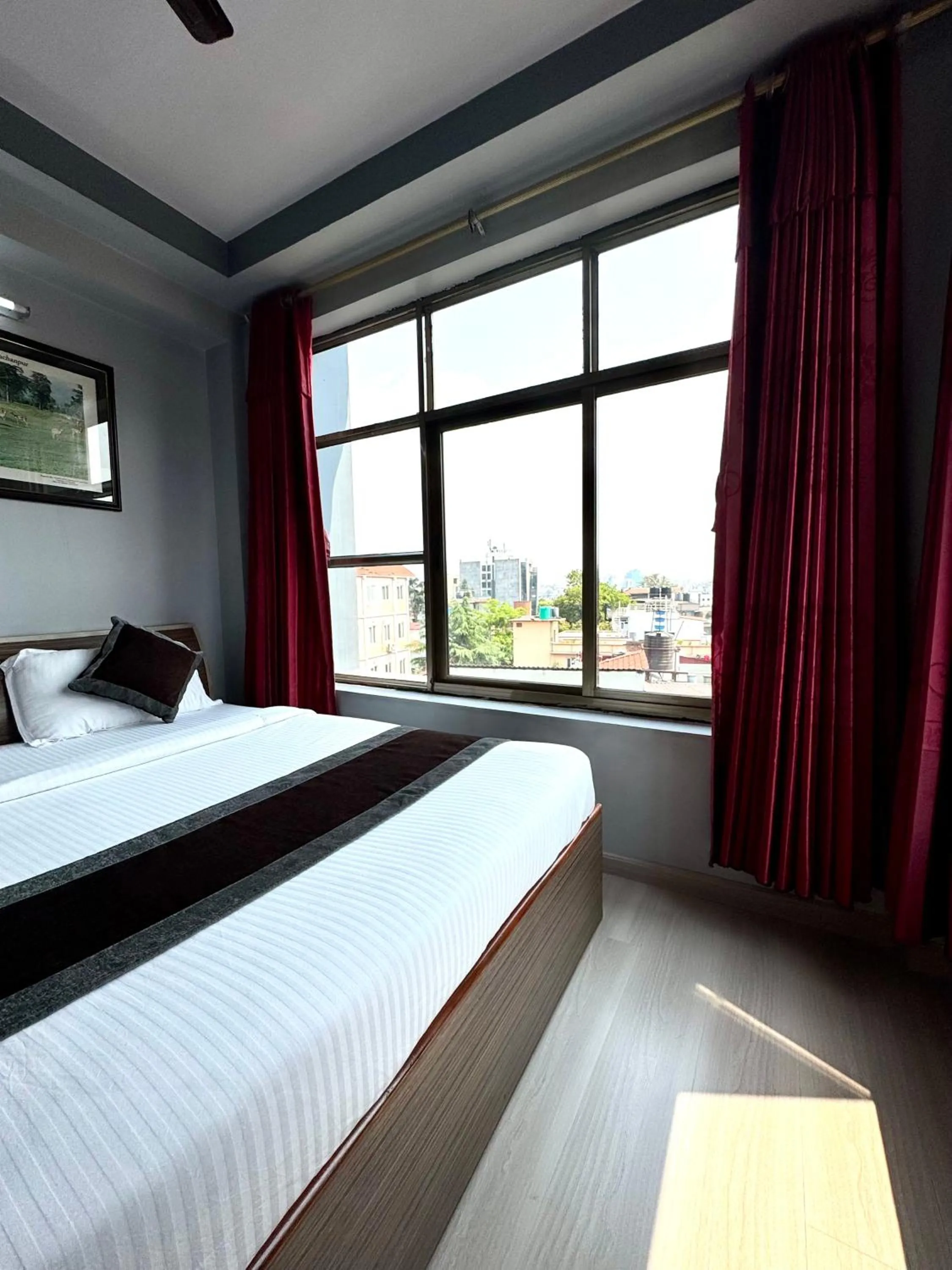 Bed in Three Brothers Apartment and Hotel