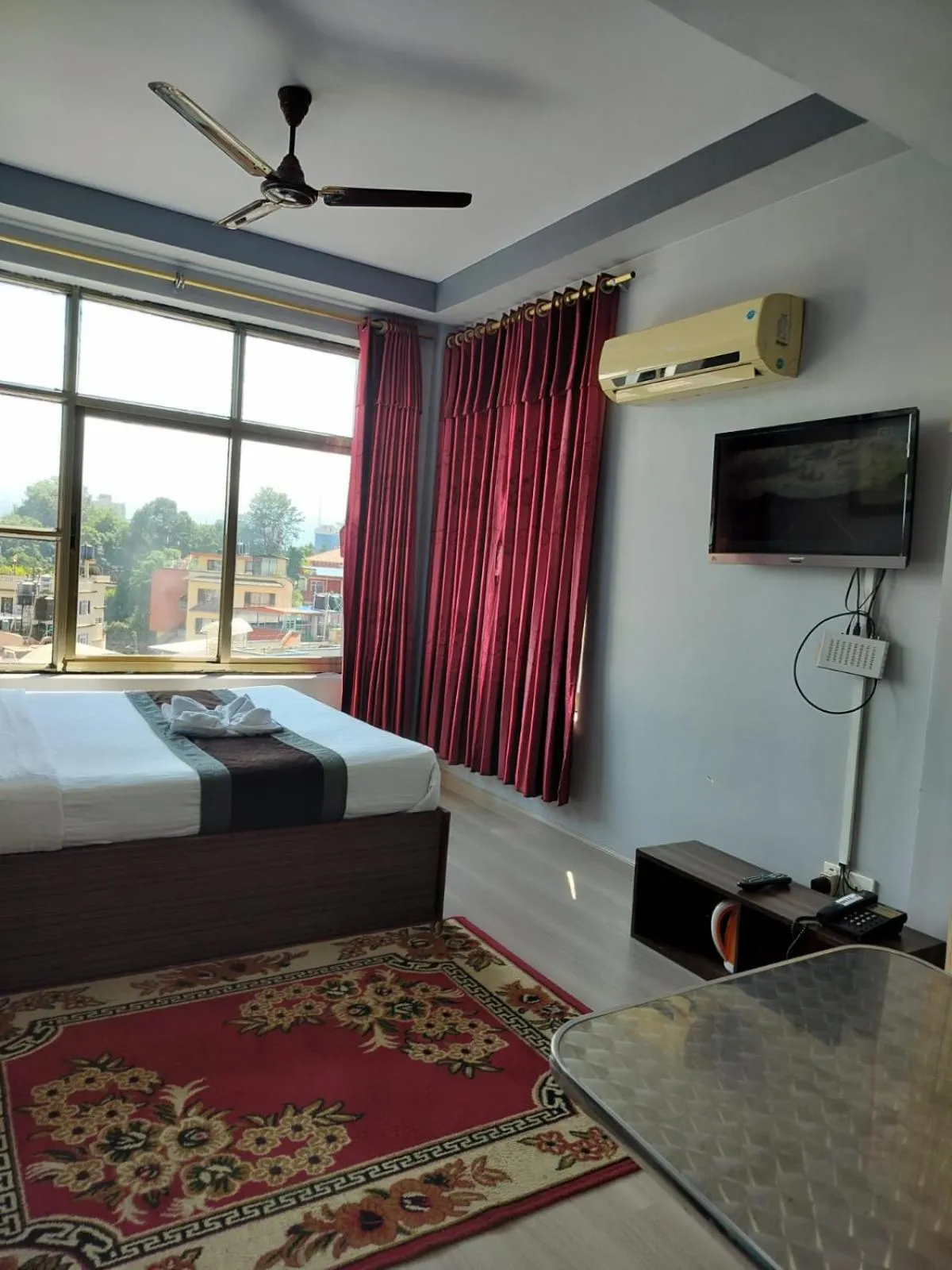 Bed in Three Brothers Apartment and Hotel