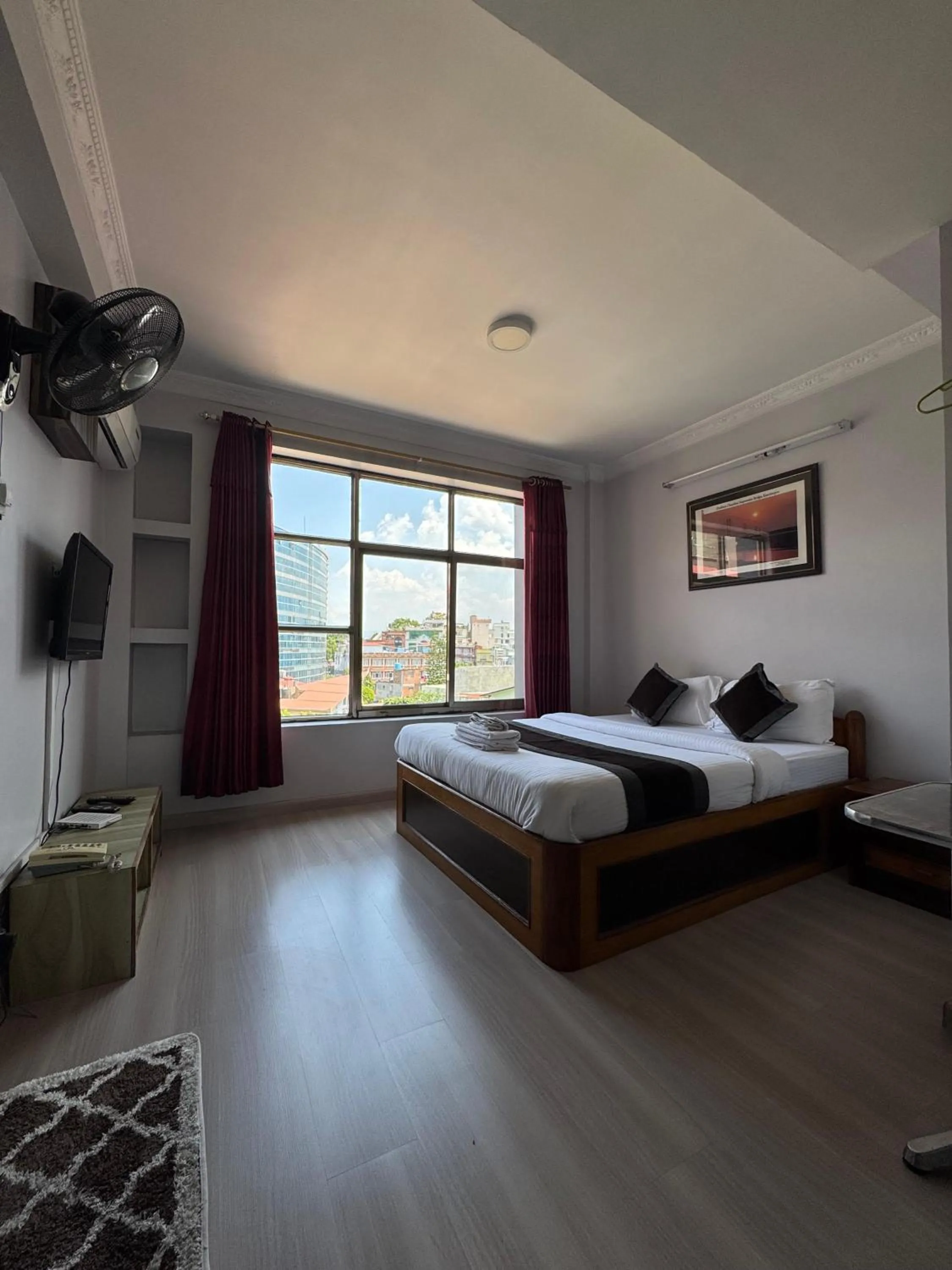 Bed in Three Brothers Apartment and Hotel