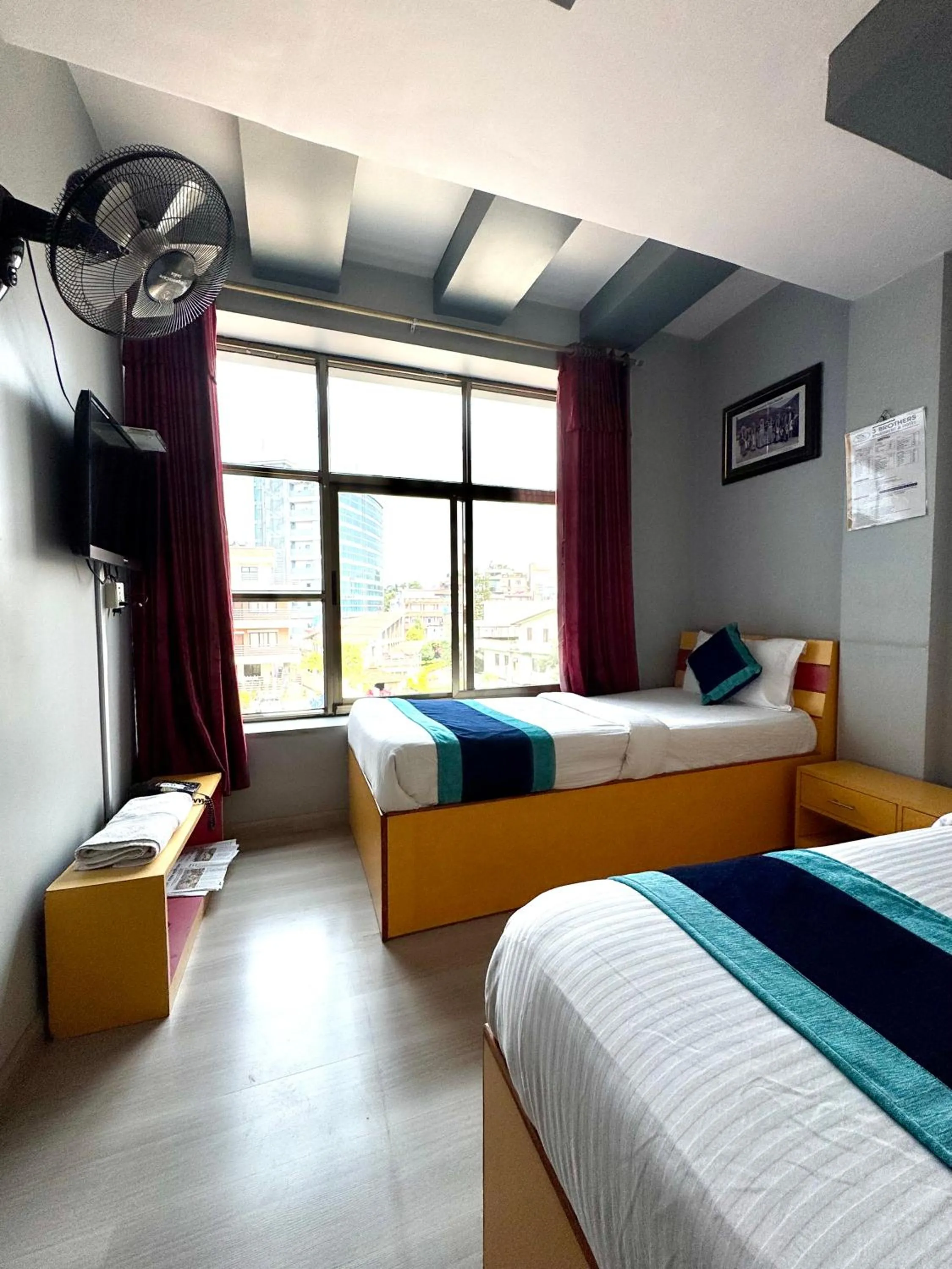 Bed in Three Brothers Apartment and Hotel