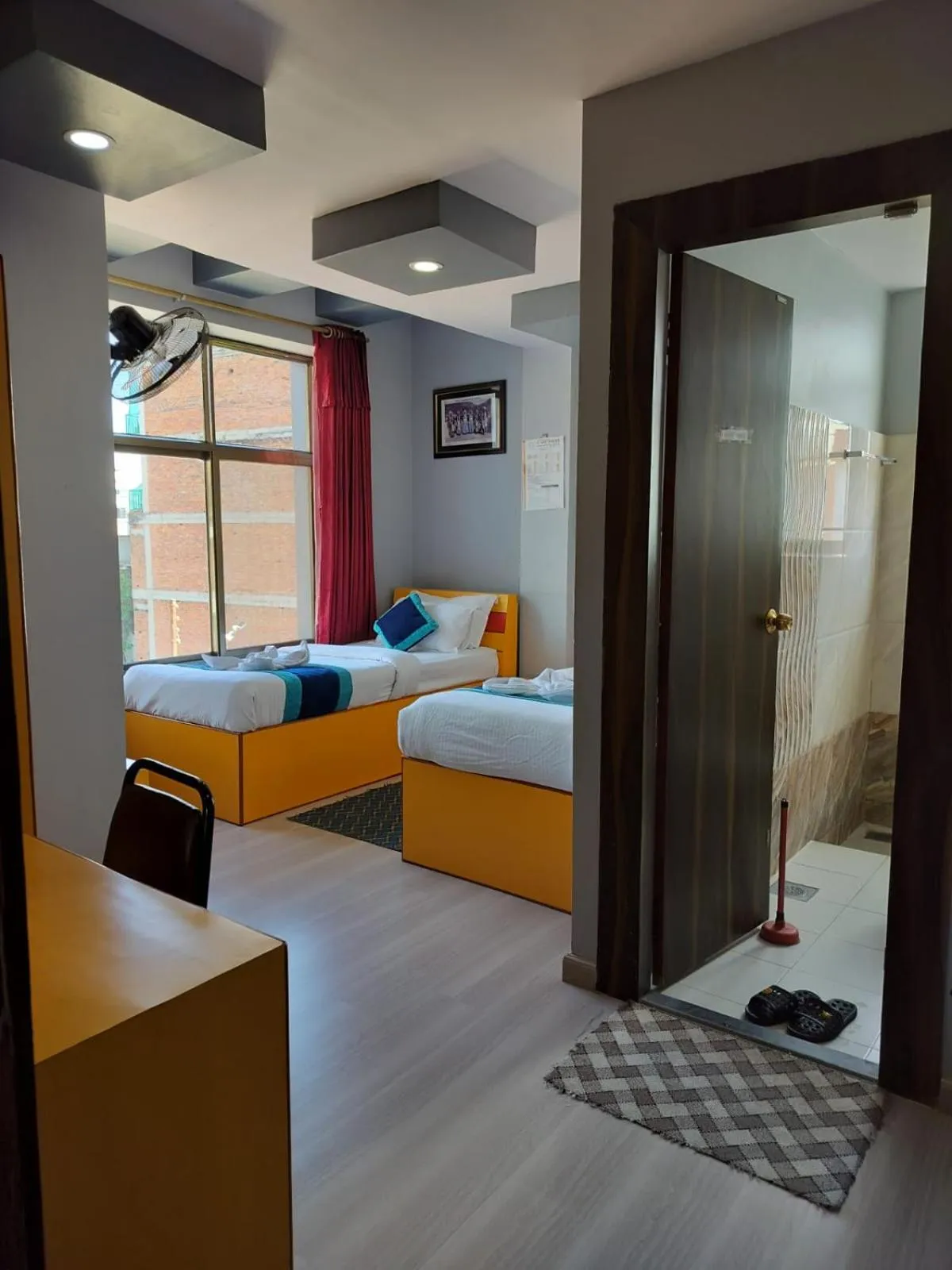 Bed in Three Brothers Apartment and Hotel