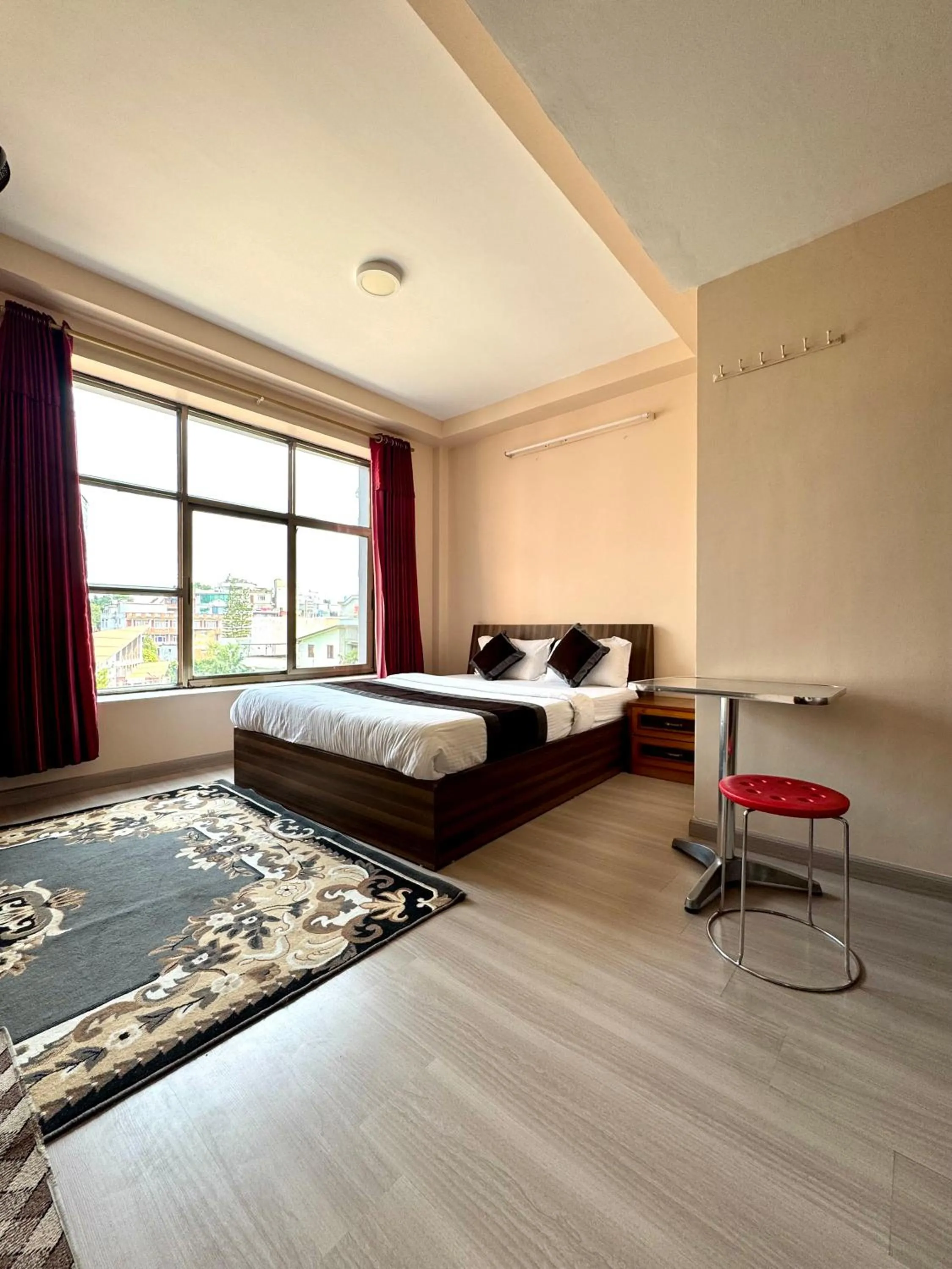 Bed in Three Brothers Apartment and Hotel
