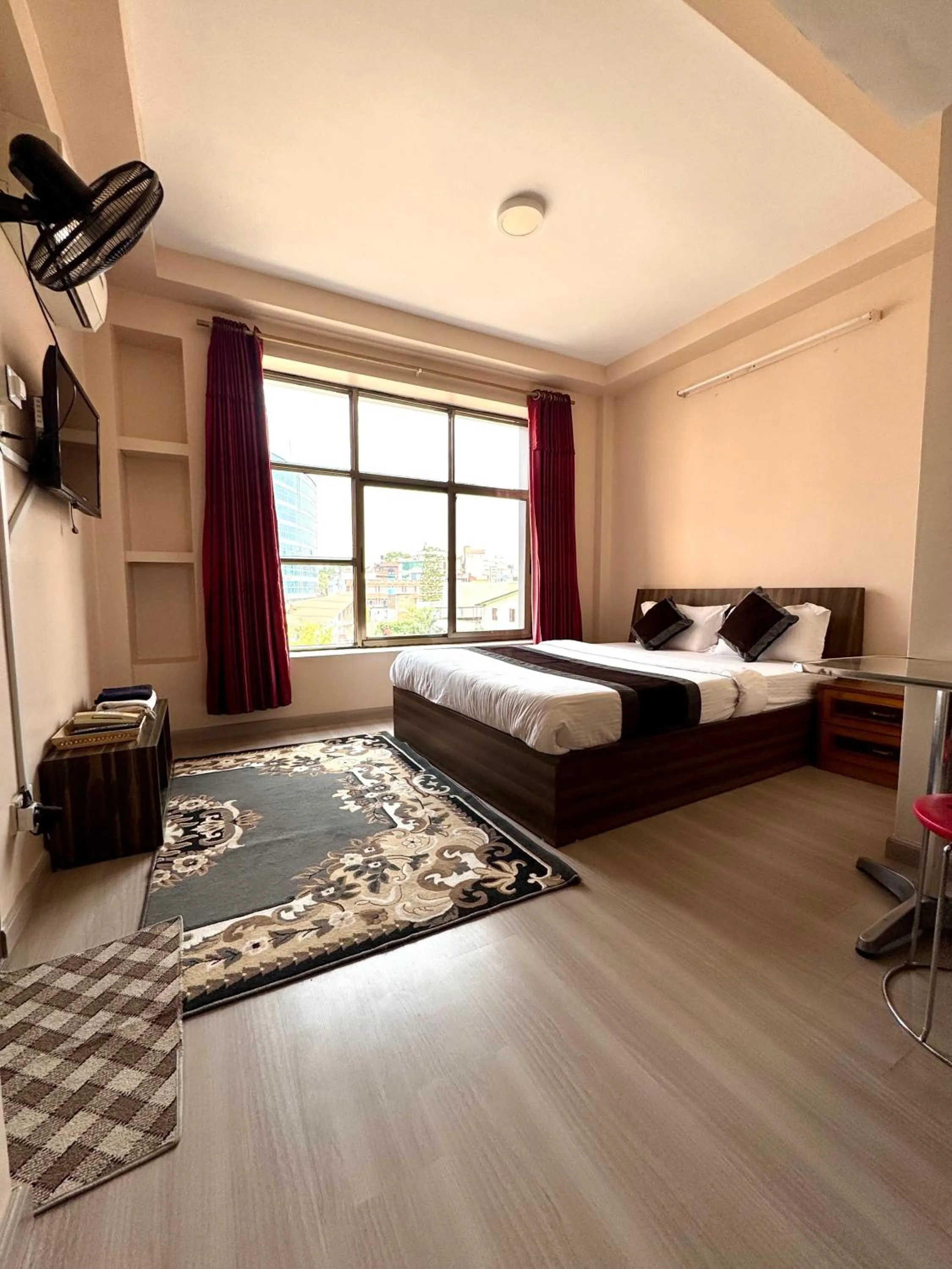 Bed in Three Brothers Apartment and Hotel