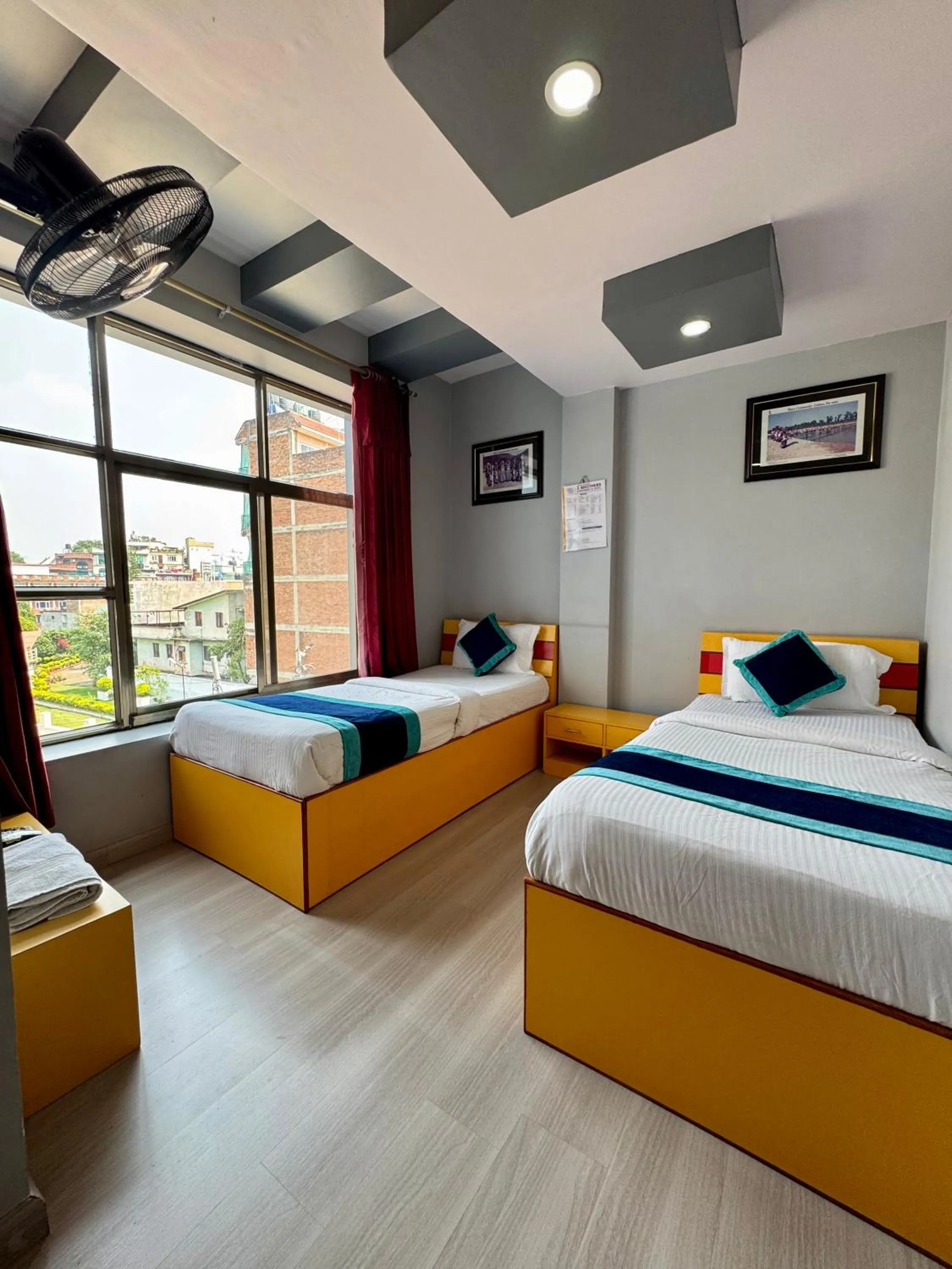 Bed in Three Brothers Apartment and Hotel
