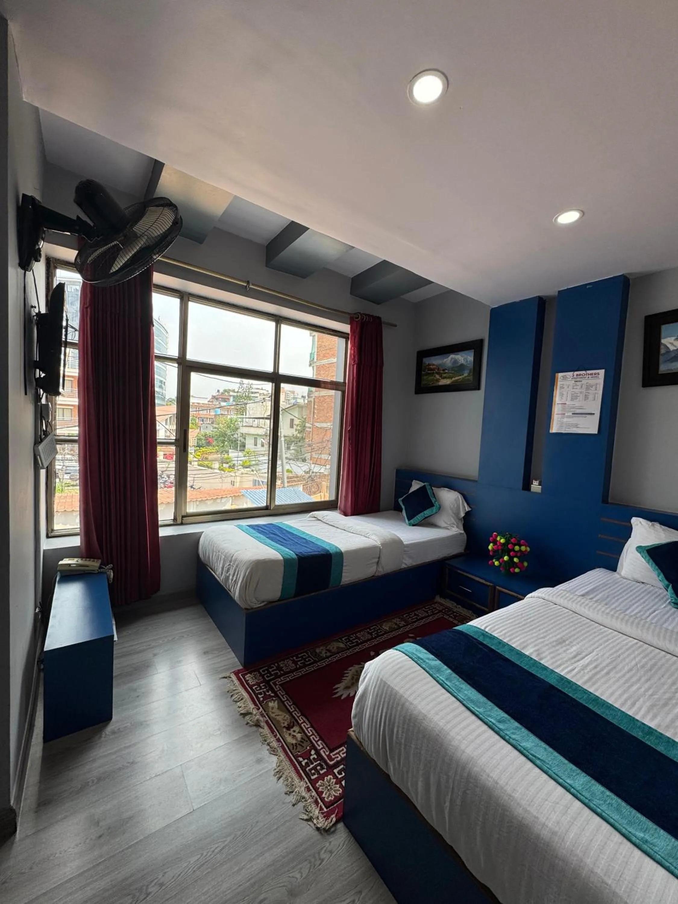Bed in Three Brothers Apartment and Hotel