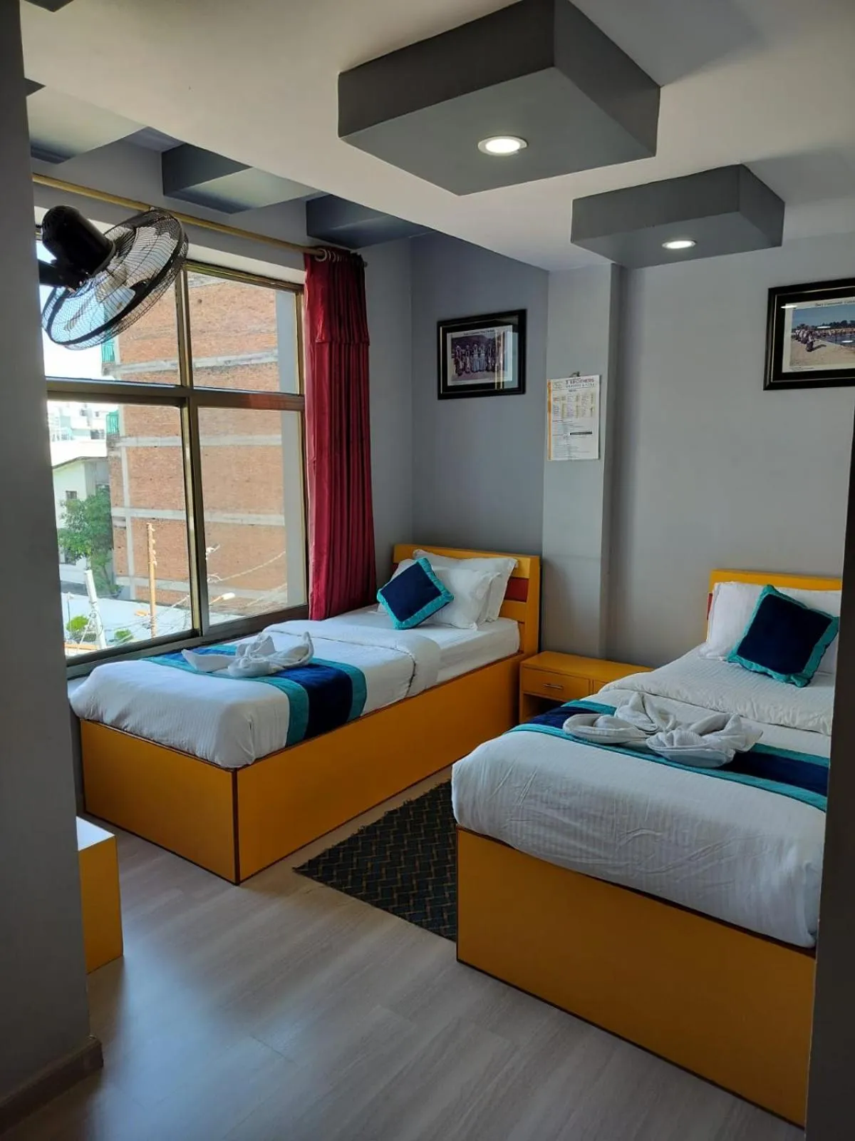 Bed in Three Brothers Apartment and Hotel