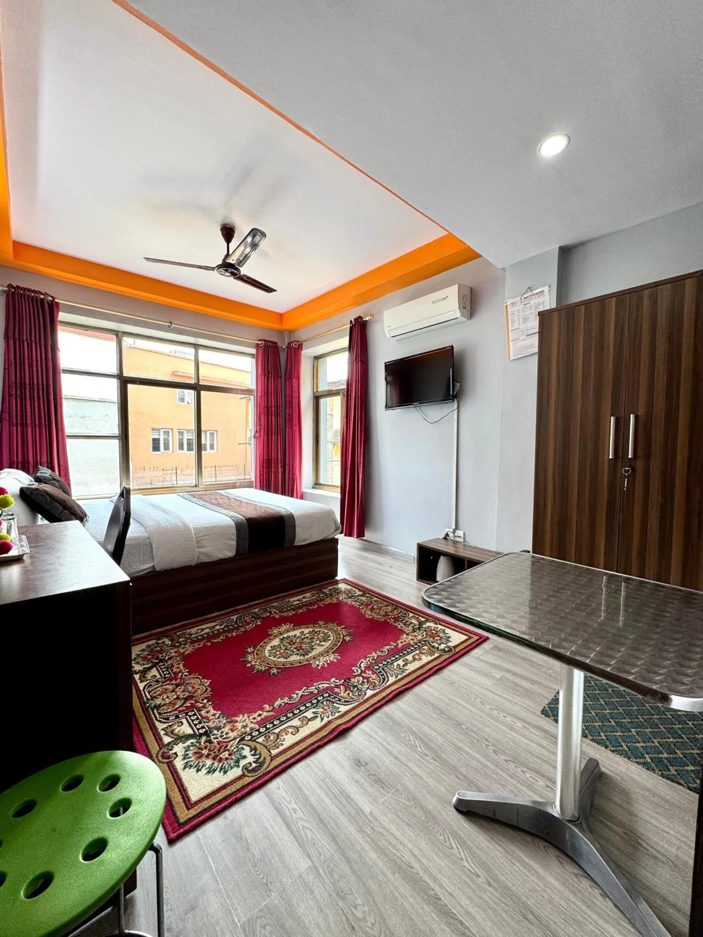 Bed in Three Brothers Apartment and Hotel