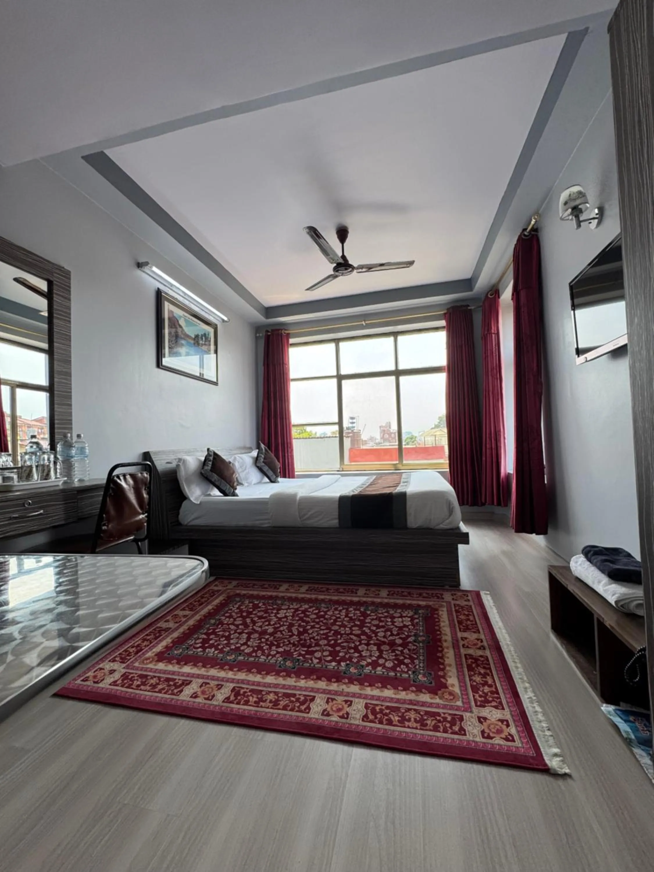 Bed in Three Brothers Apartment and Hotel