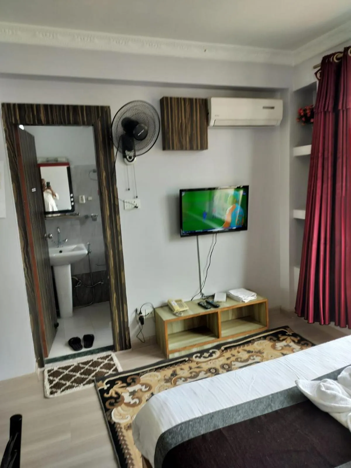 Bed in Three Brothers Apartment and Hotel