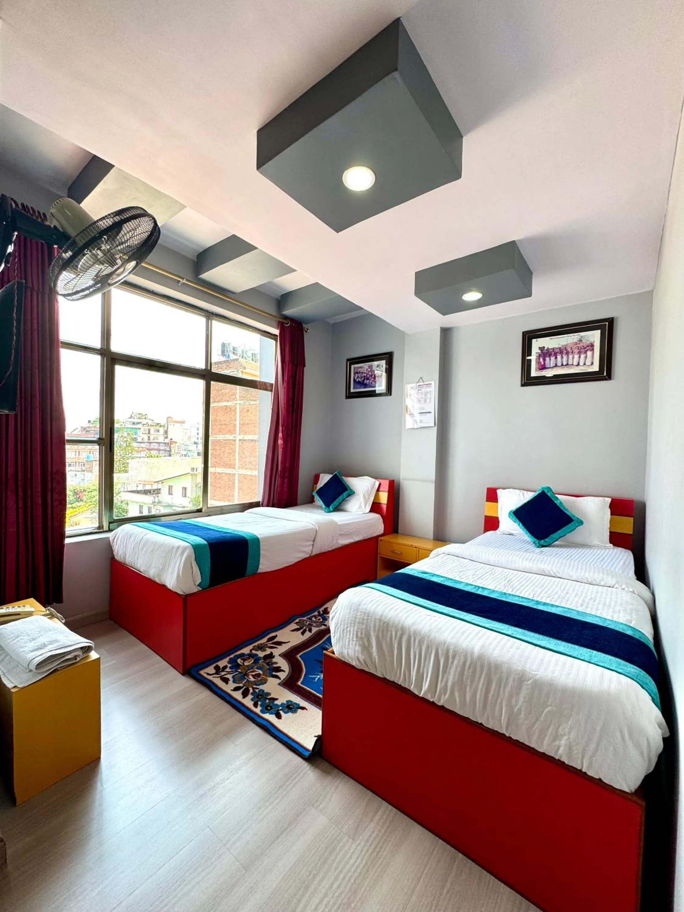Bed in Three Brothers Apartment and Hotel