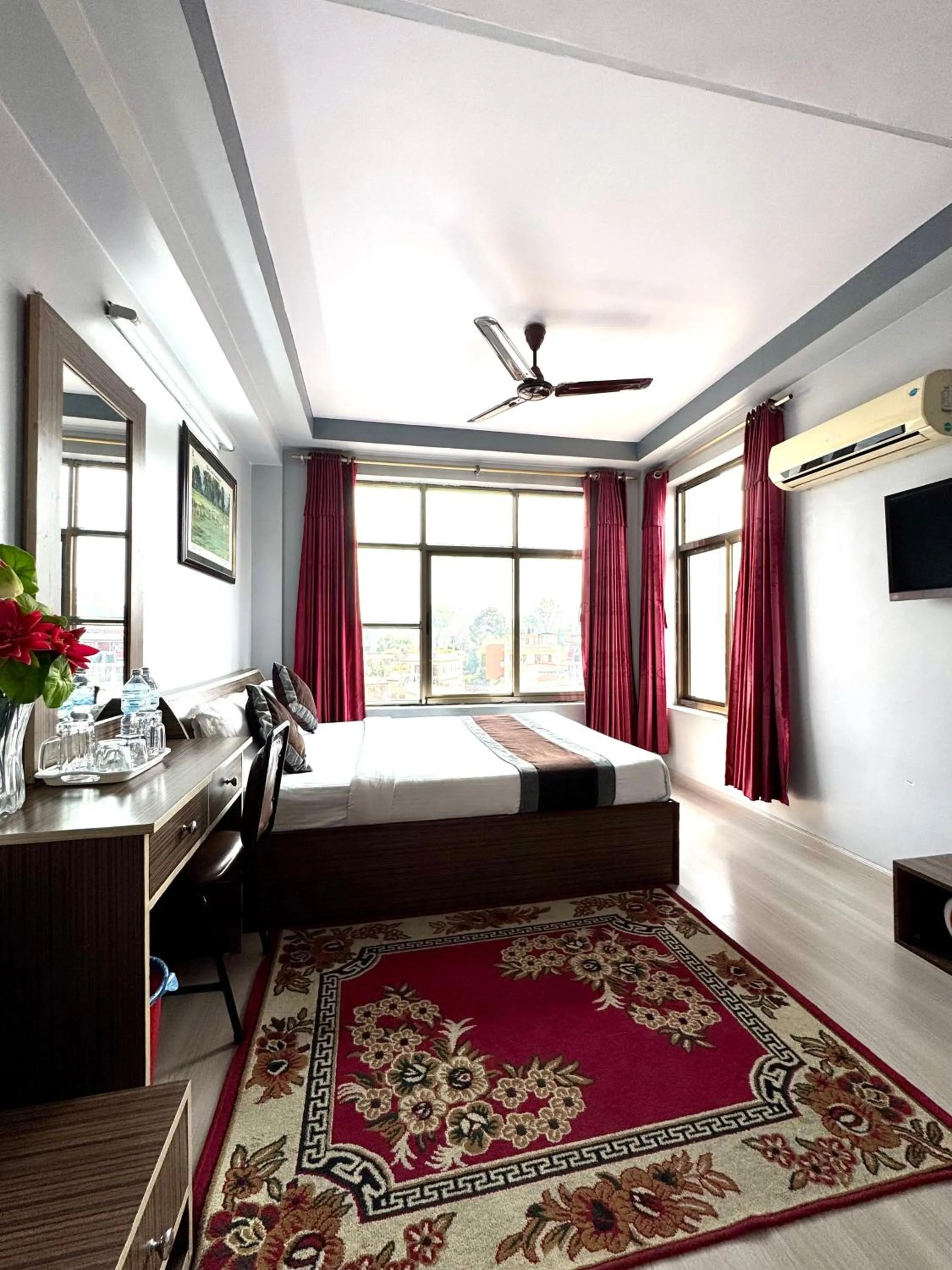 Bed in Three Brothers Apartment and Hotel