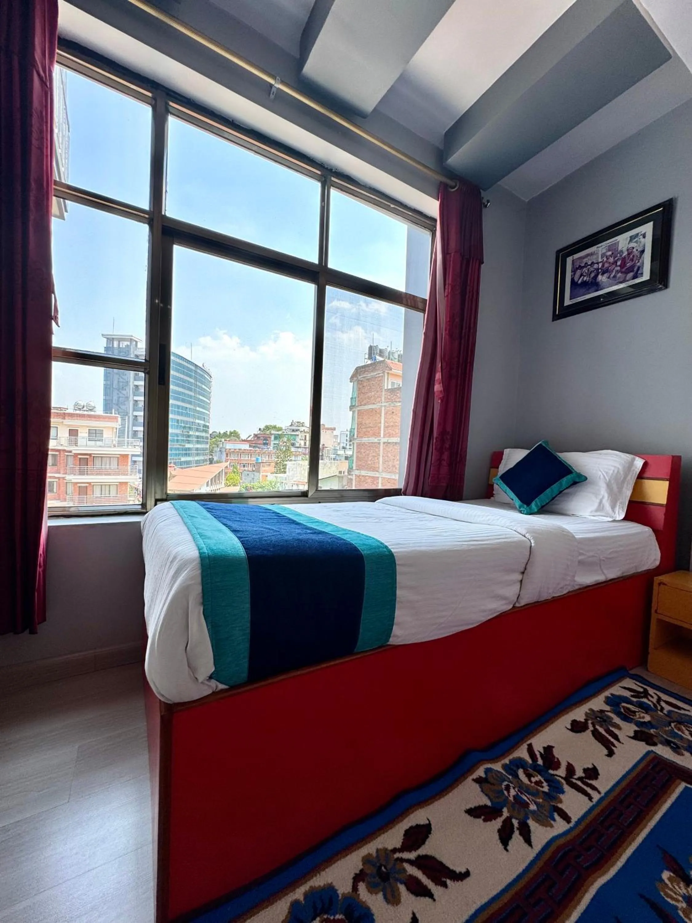 Bed in Three Brothers Apartment and Hotel