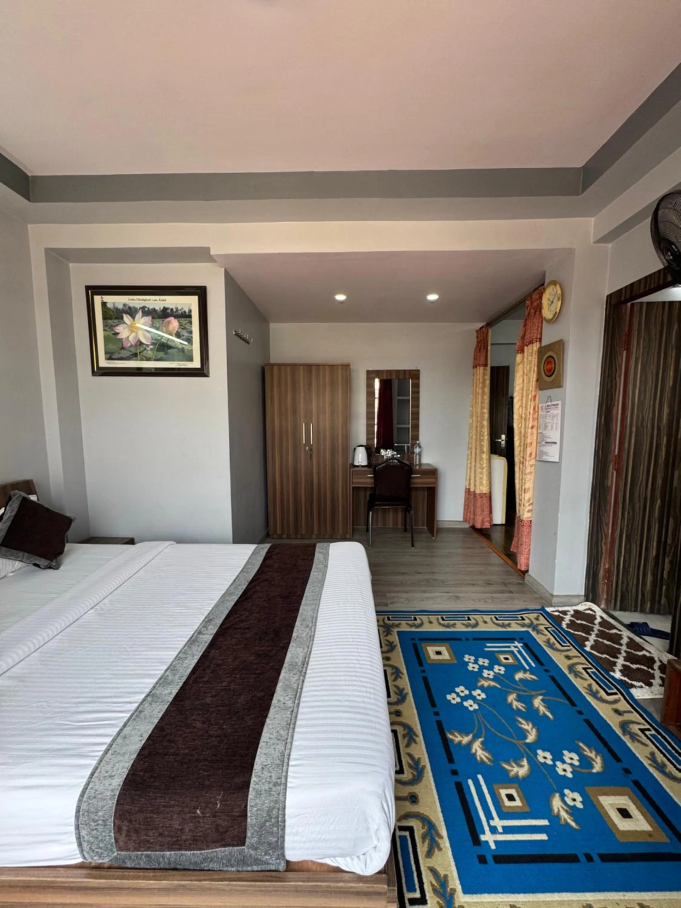 Bed in Three Brothers Apartment and Hotel