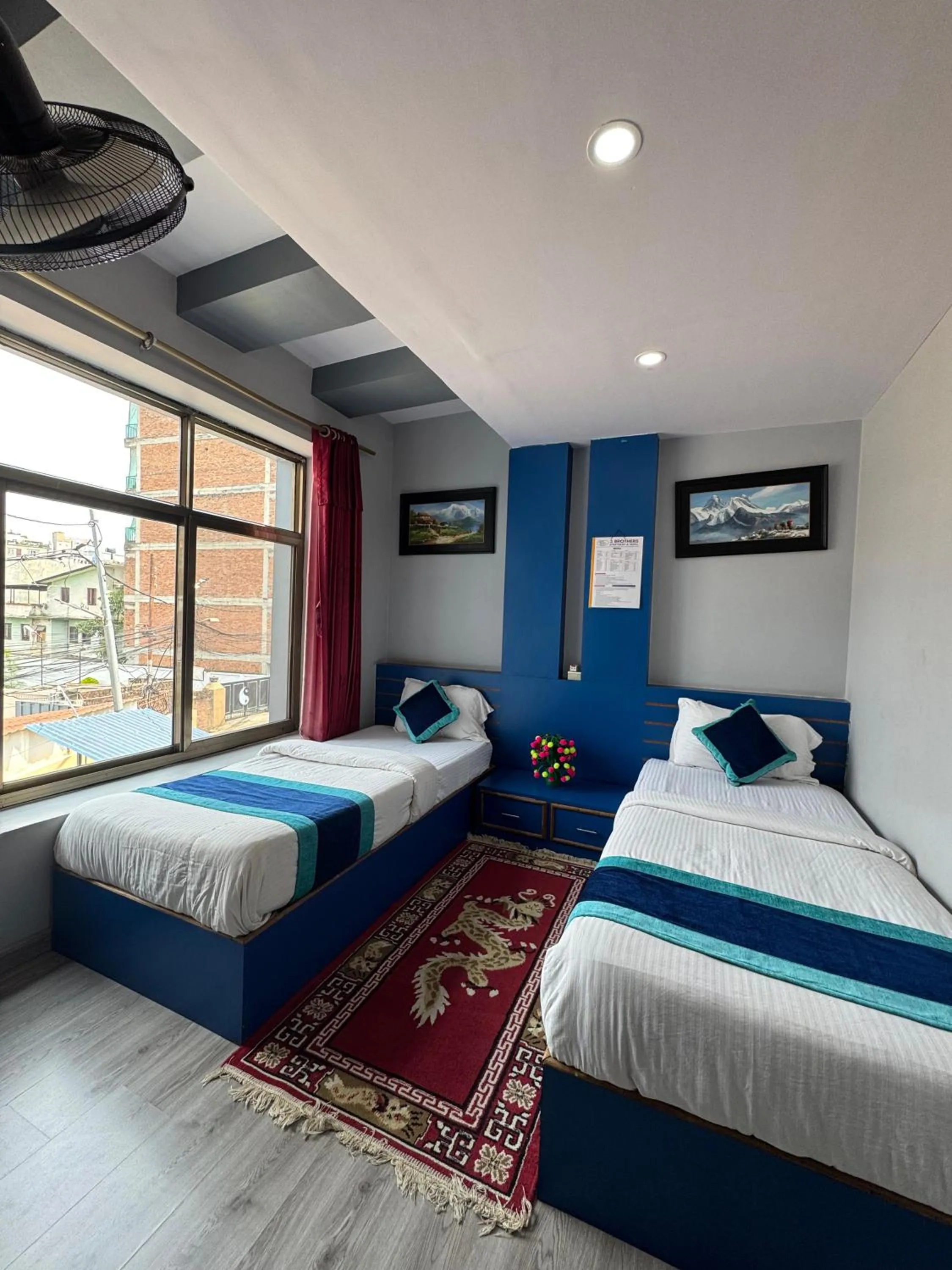 Bed in Three Brothers Apartment and Hotel