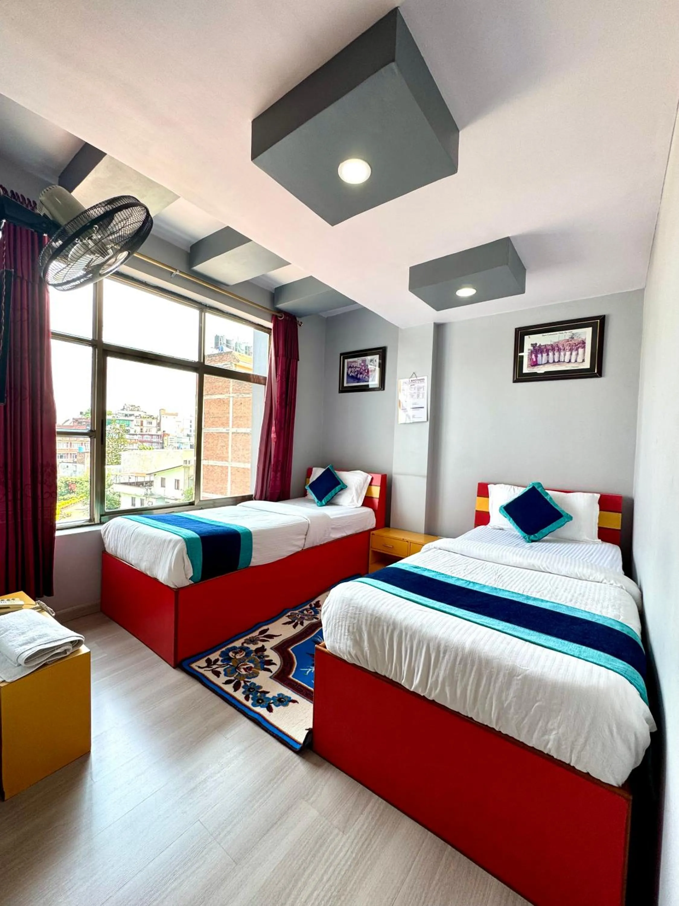 Bed in Three Brothers Apartment and Hotel