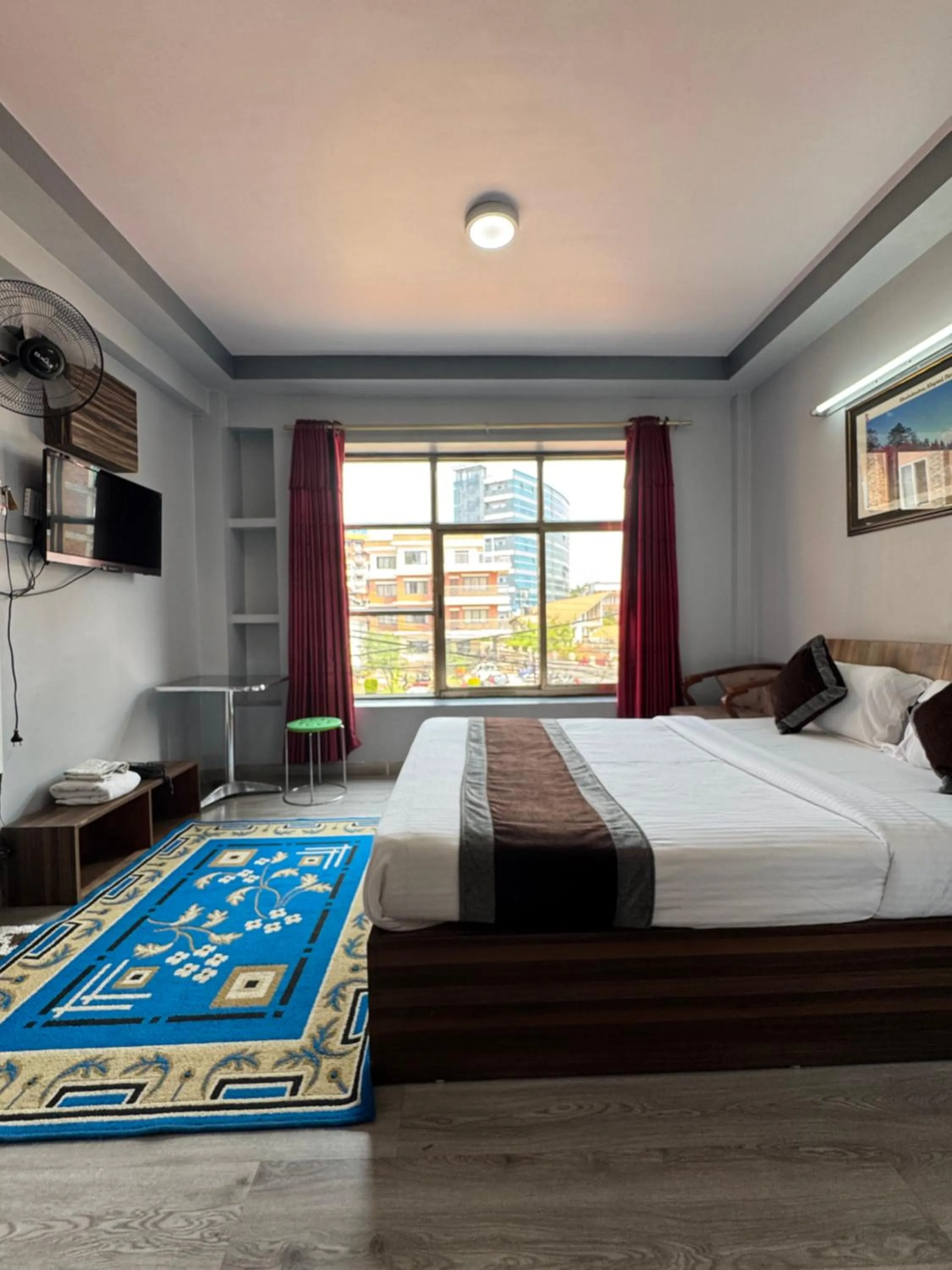 Bed in Three Brothers Apartment and Hotel