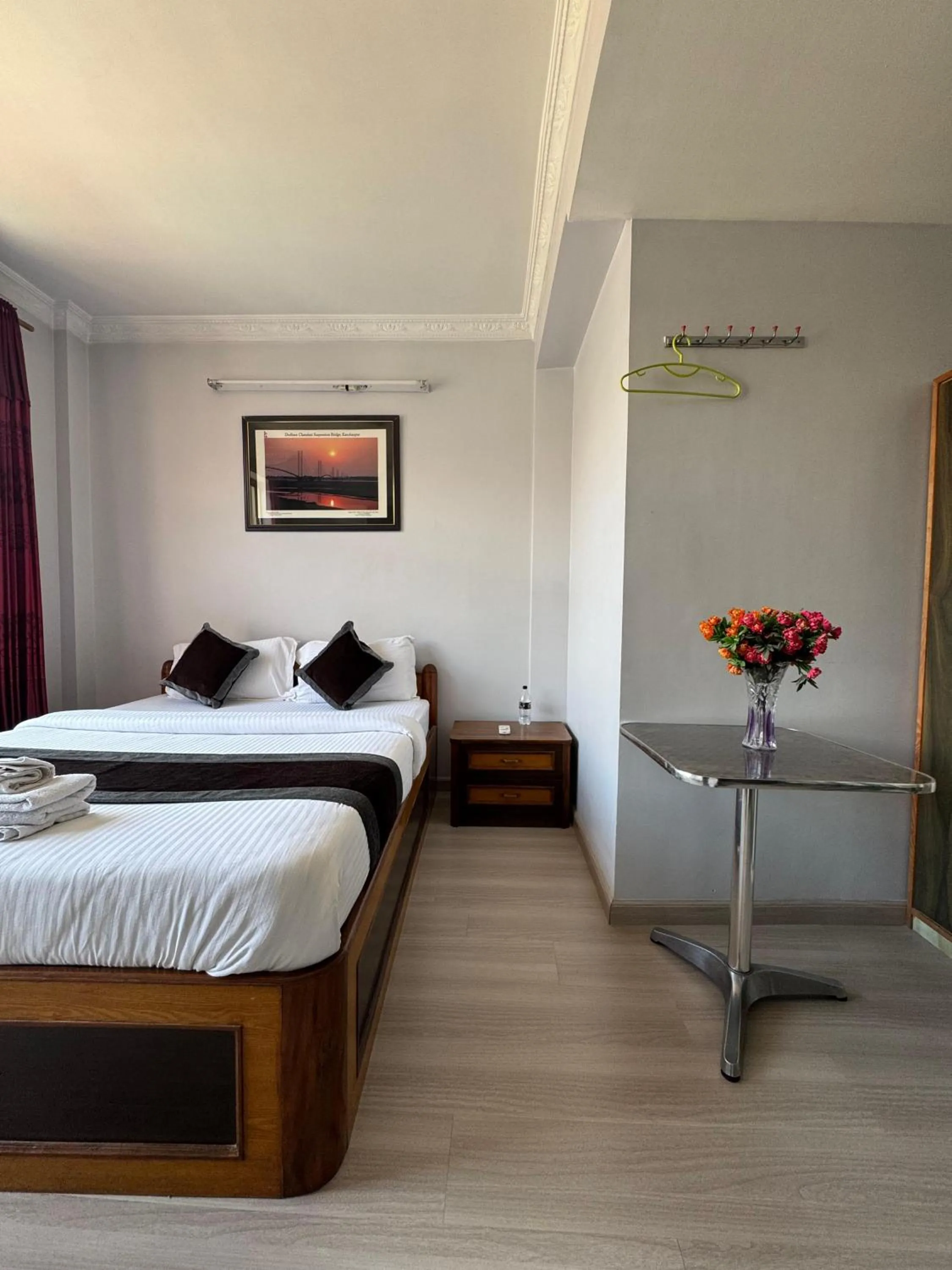 Bed in Three Brothers Apartment and Hotel