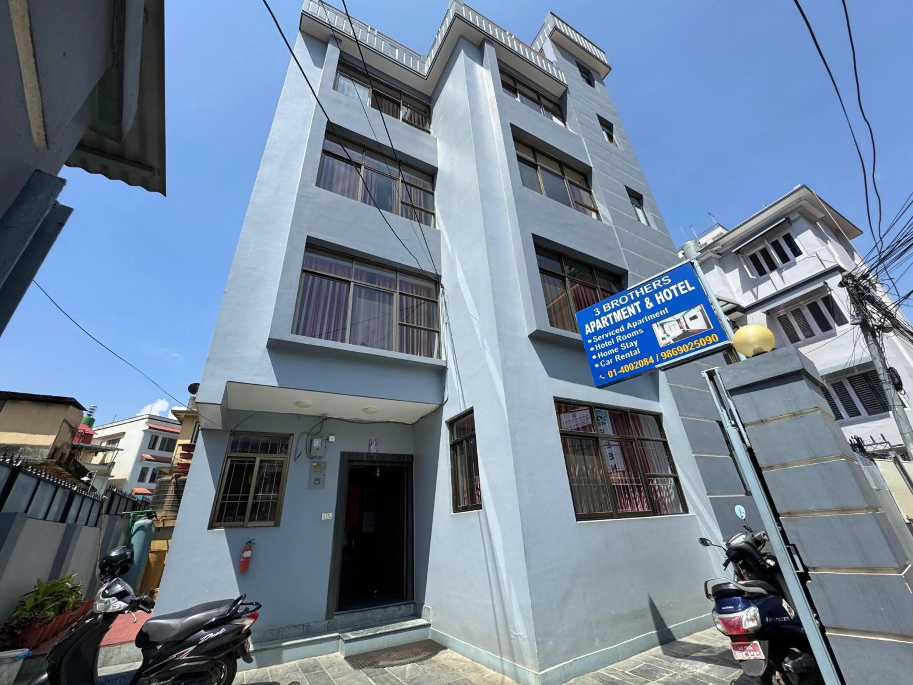 Property building in Three Brothers Apartment and Hotel