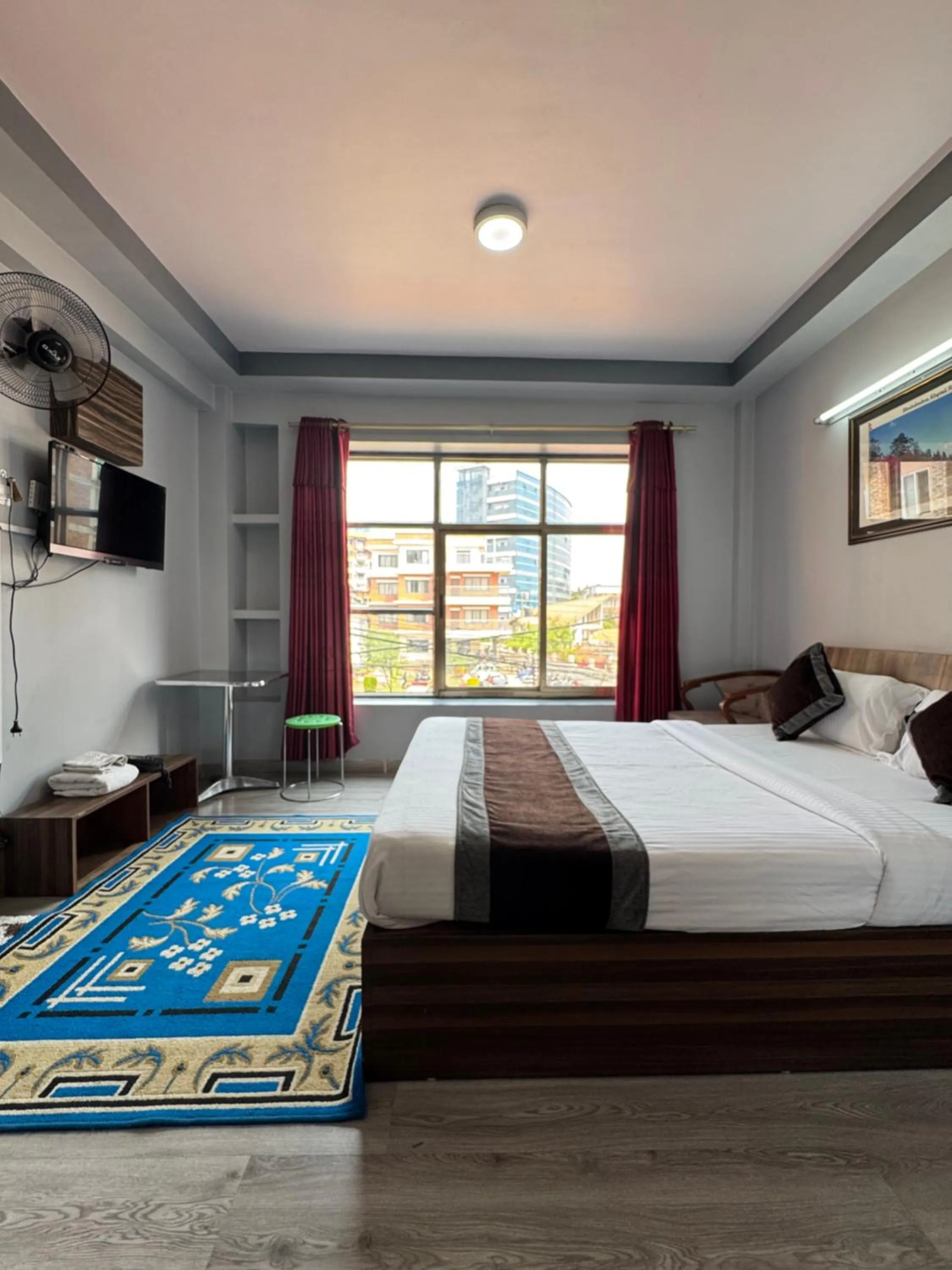Bed in Three Brothers Apartment and Hotel