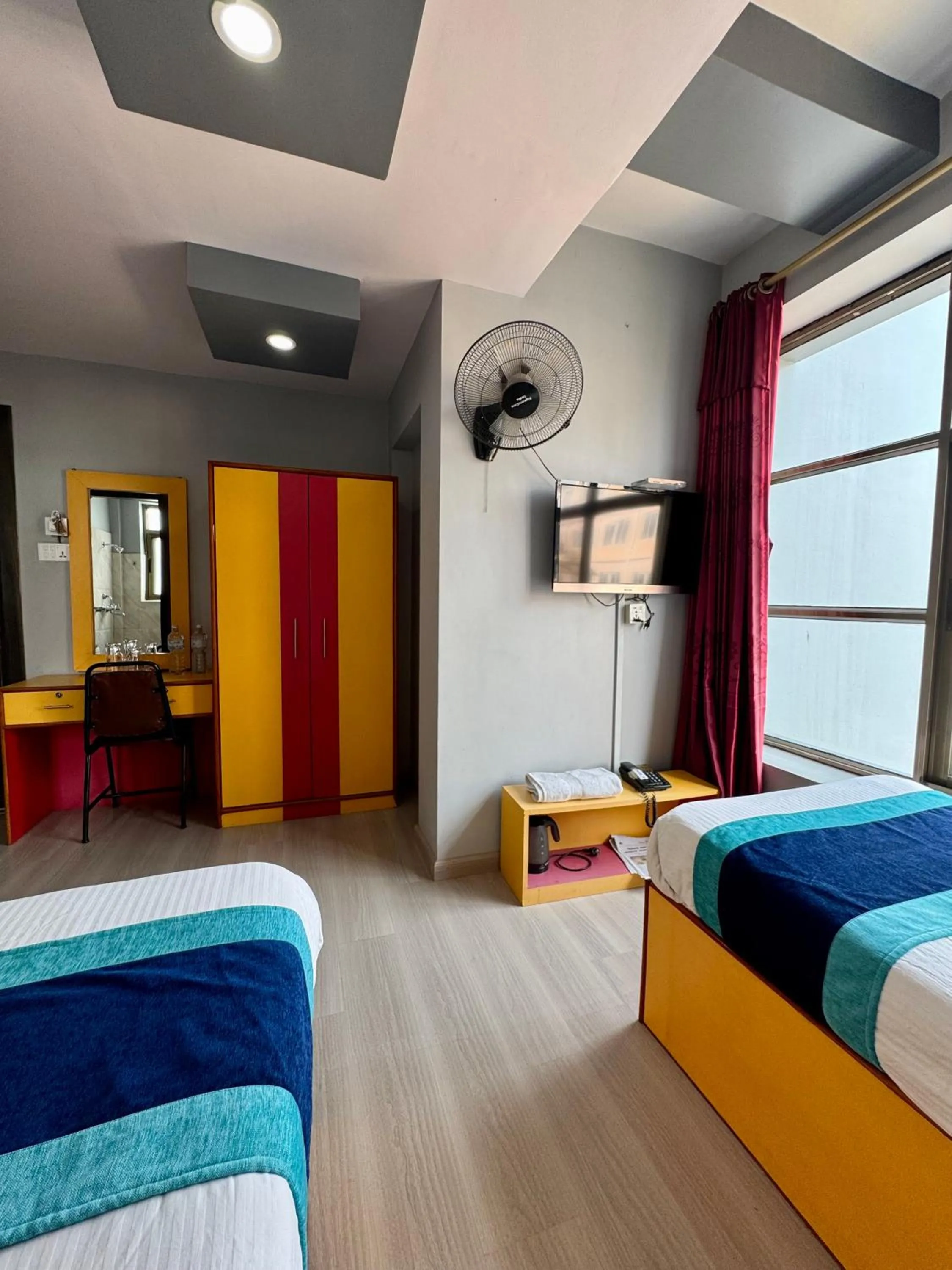 Bed in Three Brothers Apartment and Hotel