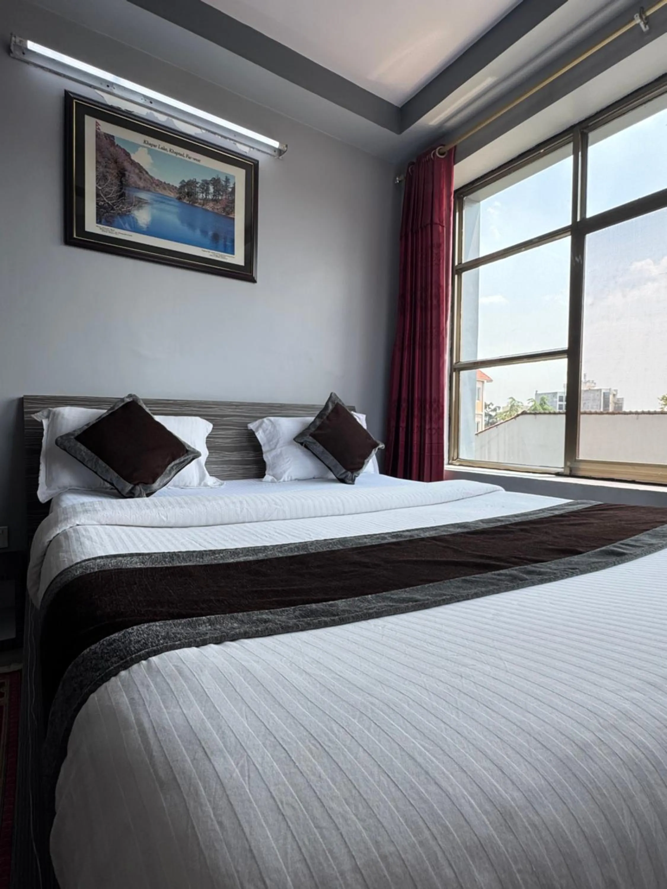 Bed in Three Brothers Apartment and Hotel