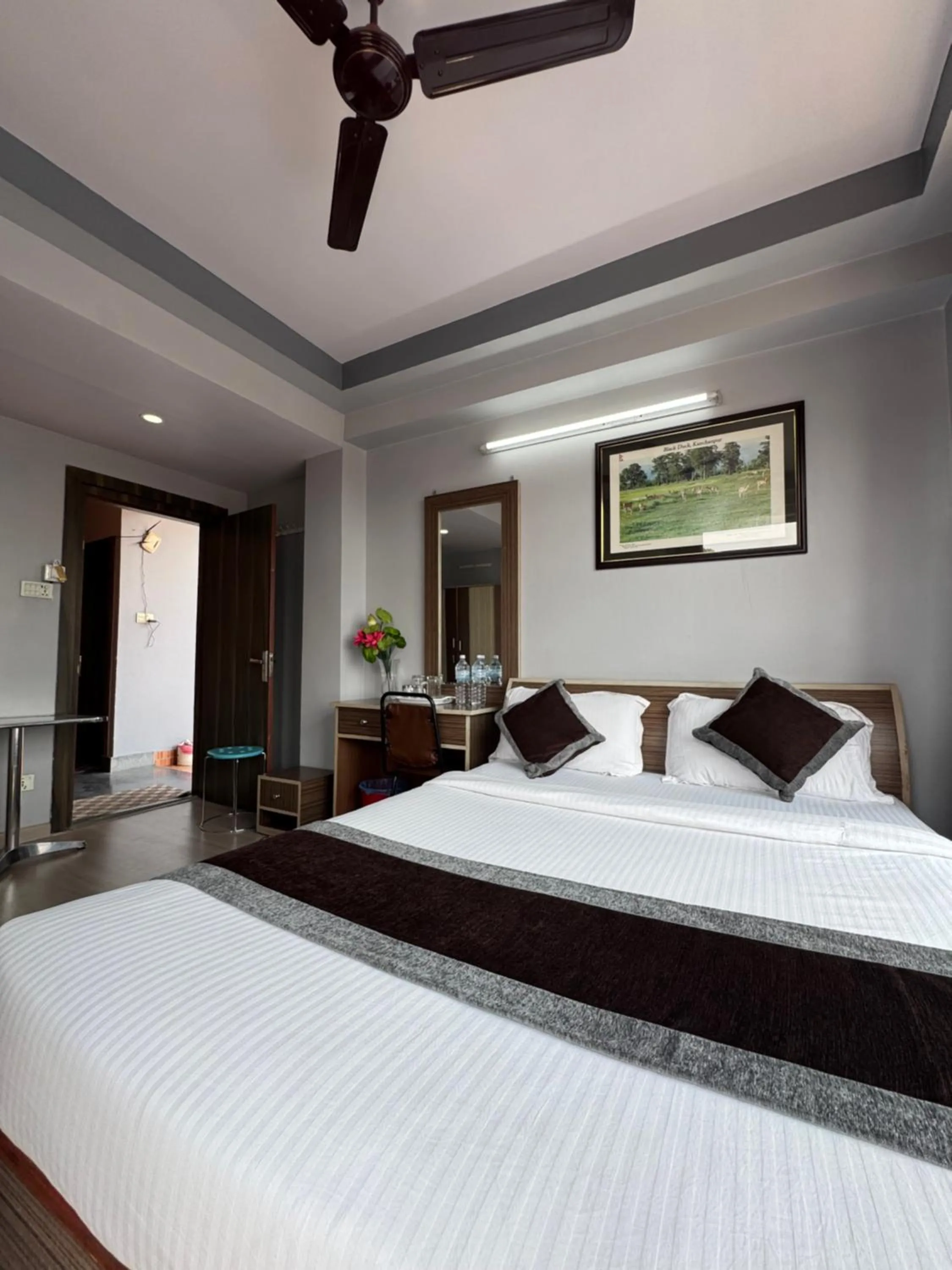 Bed in Three Brothers Apartment and Hotel